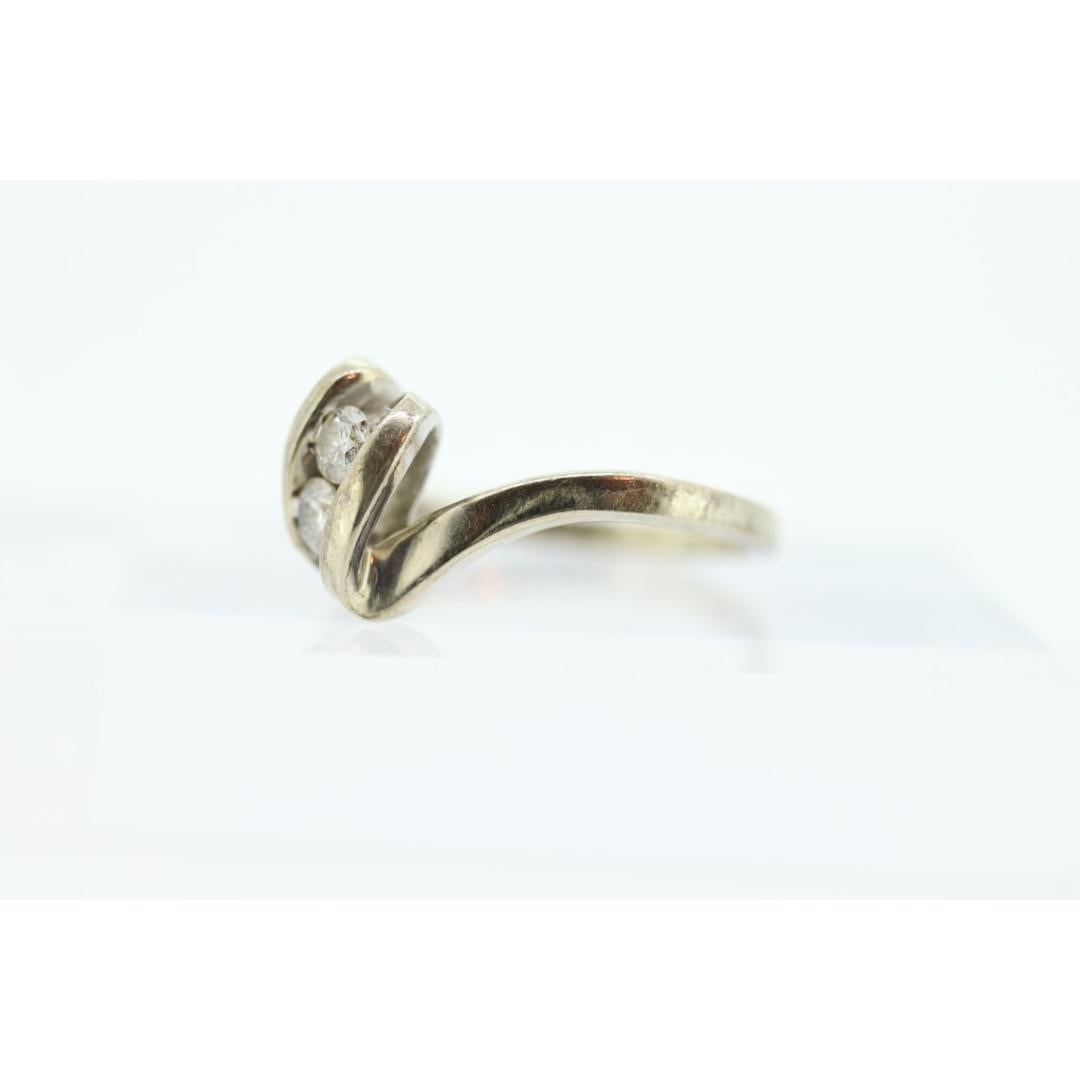 Diamond Tension Ring. 10k White Gold Diamond Bypass Double diamond Swirl Swivel For Sale 1