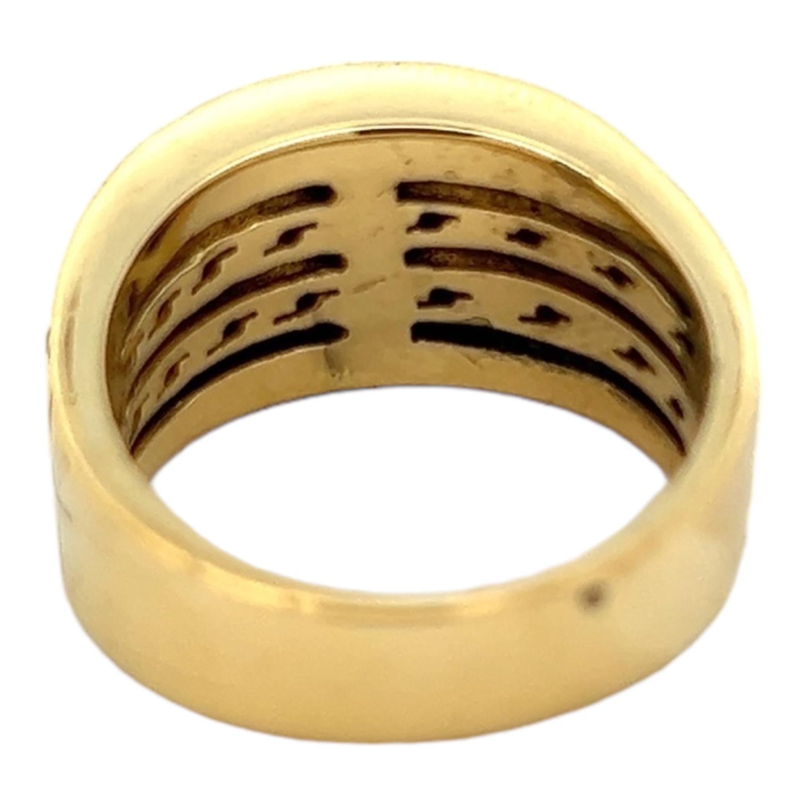Diamond cigar band crafted in textured 18 karat yellow gold. The band features 36 round brilliant cut diamonds weighing approximately .76 CTW and graded G-I color and SI clarity. The ring measures 12mm in width and is currently size 8.5 (can be