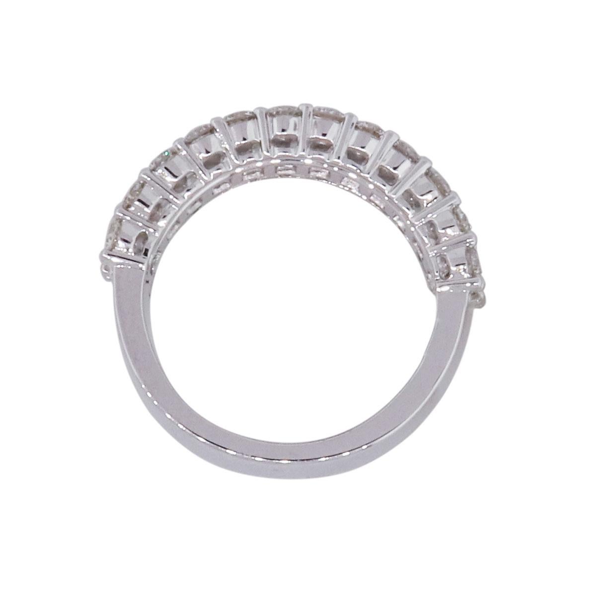 Material: 18k white gold
Diamond Details: Approximately 1.37ctw of round brilliant diamonds, 24 stones. Approximately 0.96ctw of emerald cut diamonds, 16 stones Diamonds are G/H in color and VS in clarity
Ring Size: 6.50 (can be sized)
Ring