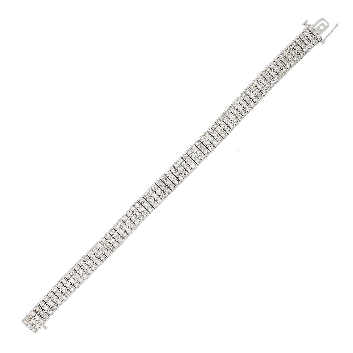 This tri-row bracelet features 7 carats of glistening white diamonds set in 14K white gold. This everyday bracelet is the perfect accompaniment to any outfit.

Fits wrists up to 7.15 inches