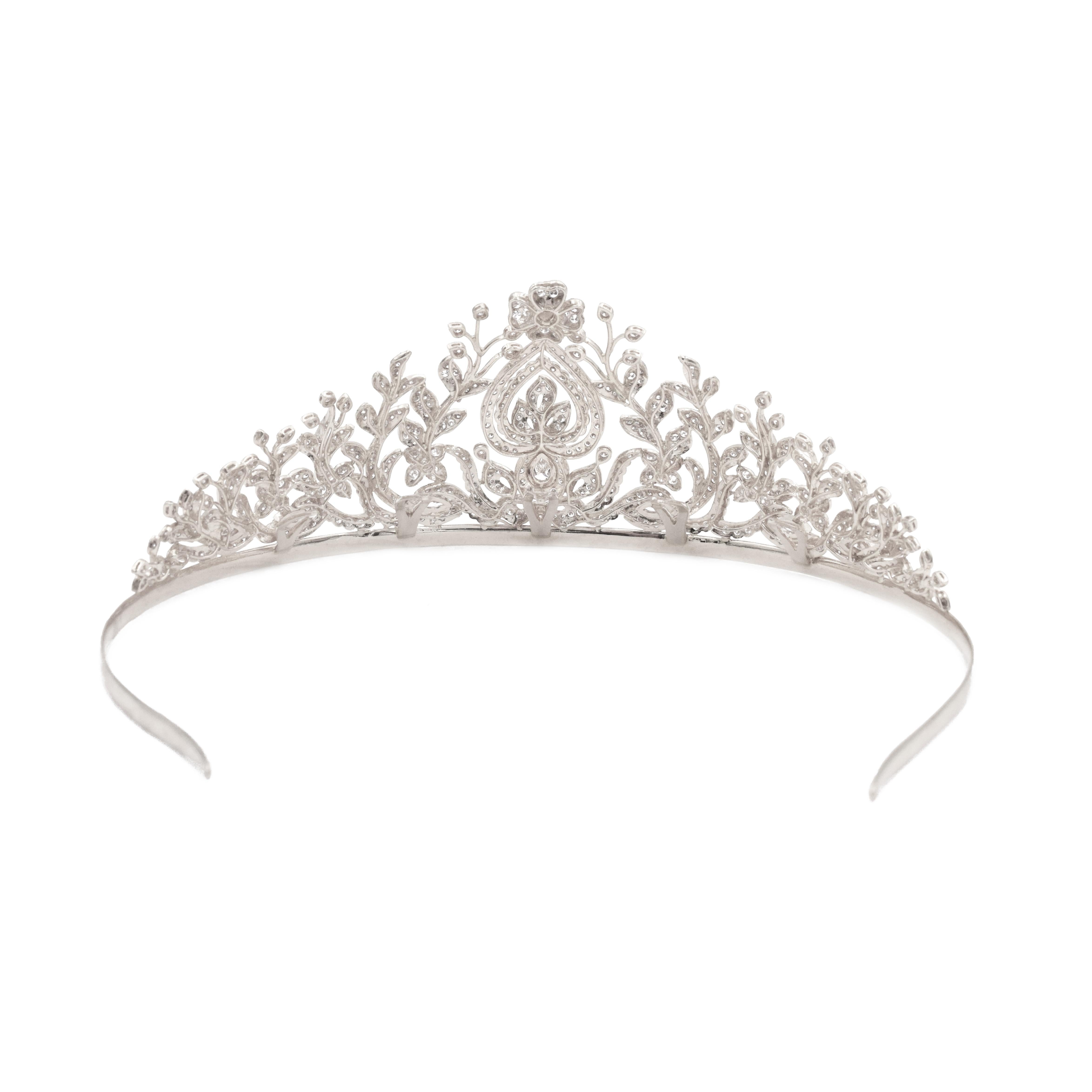 Diamond tiara, 
The floral design of the tiara is set with multiple round brilliant cut diamonds, six marquise cut diamonds and one pear shape diamond weighing total of approximately 20carats.
measures 5.5 inches in width and it's 2.25 inches high.