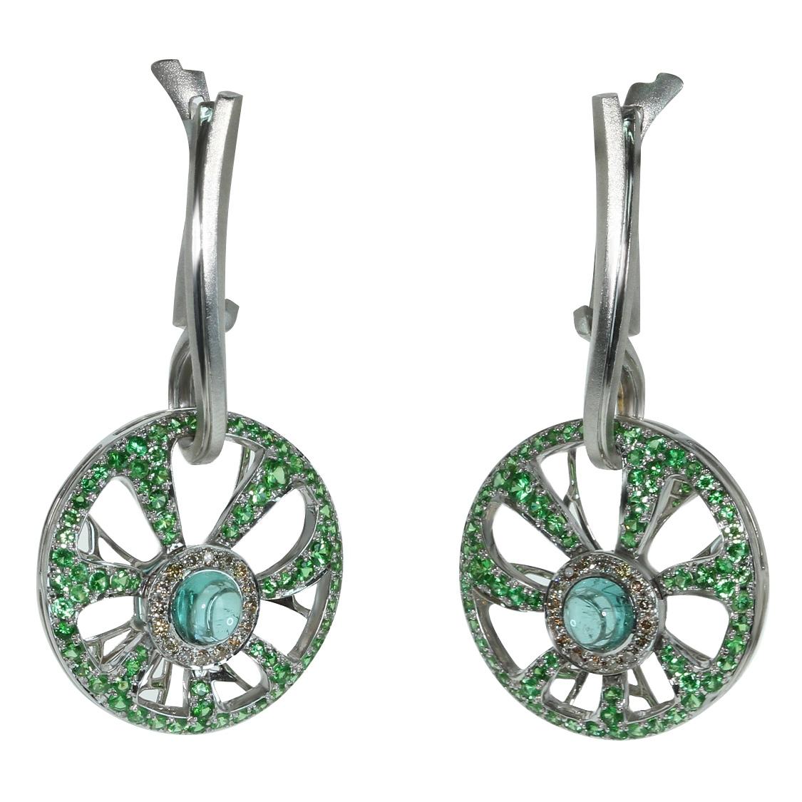 Diamond Tourmaline Tsavorite 18 Karat White Gold Earrings

Unusual neon-greenish Brazilian tourmaline trapped by tsavorite spider web. Gently combination of pure green, light champagne and neon-green attract attention. It`s hard to escape from