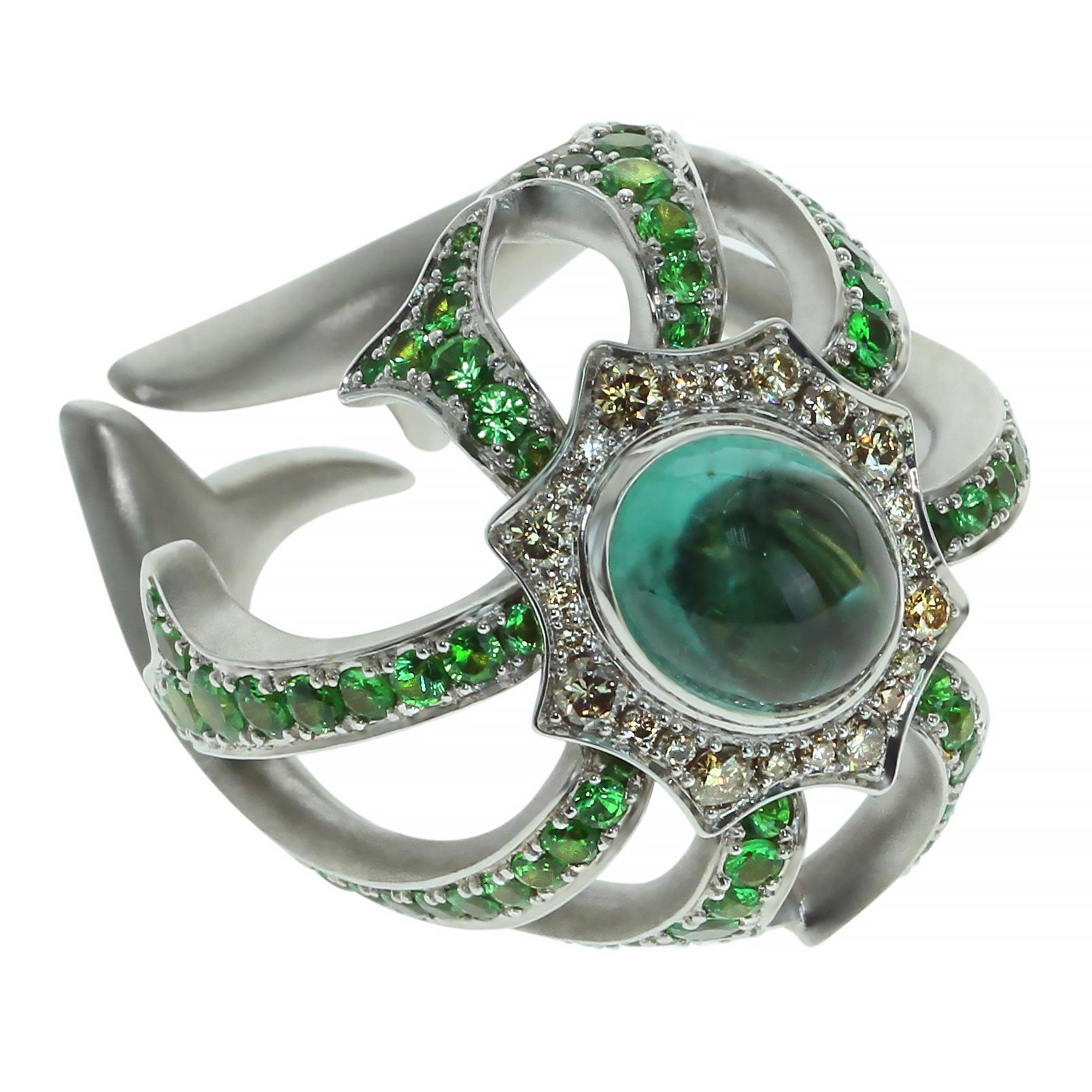 Diamond Tourmaline Tsavorite 18 Karat White Gold Ring 

Unusual neon-greenish Brazilian tourmaline trapped by tsavorite spider web. Gently combination of pure green, light champagne and neon-green attract attention. It`s hard to escape from spider