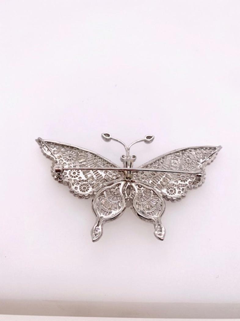 Exquisite 18k white gold Diamond Butterfly pin, en tremblant antenna. 5 1/2 cts of round, baguette, and marquis shaped full cut diamonds.
Absolutely beautiful.