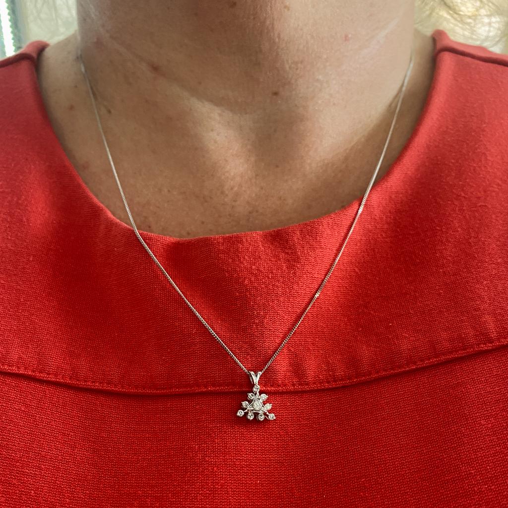 This unique sunburst triangle pendant is graceful and petite, perfect for wearing alone or layered with other favorites. Every time you wear a triangle, you send a strong message to the world. Triangles in jewelry designs are associated with