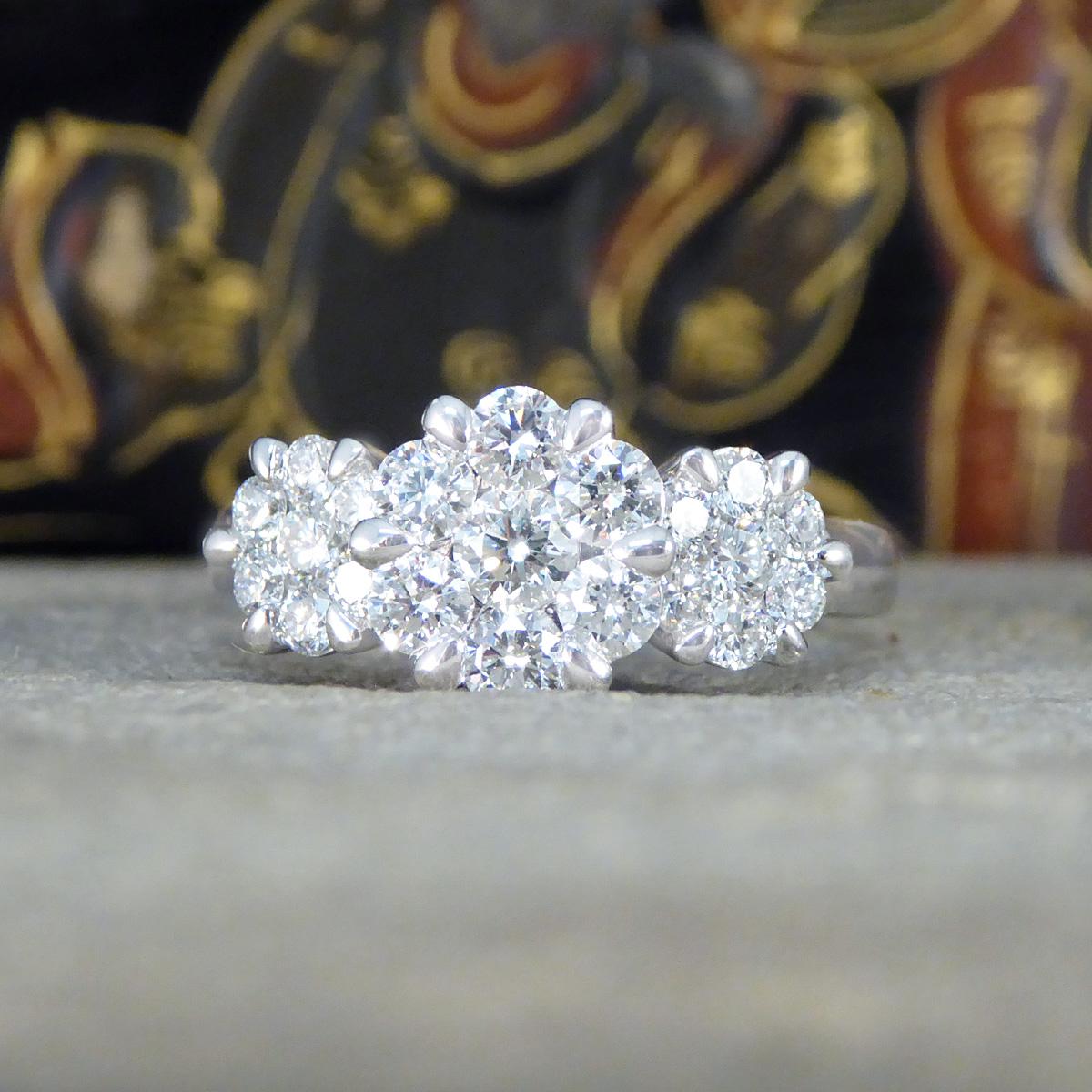 Diamond Triple Daisy Cluster Illusion Three Stone Ring in Platinum In New Condition In Yorkshire, West Yorkshire