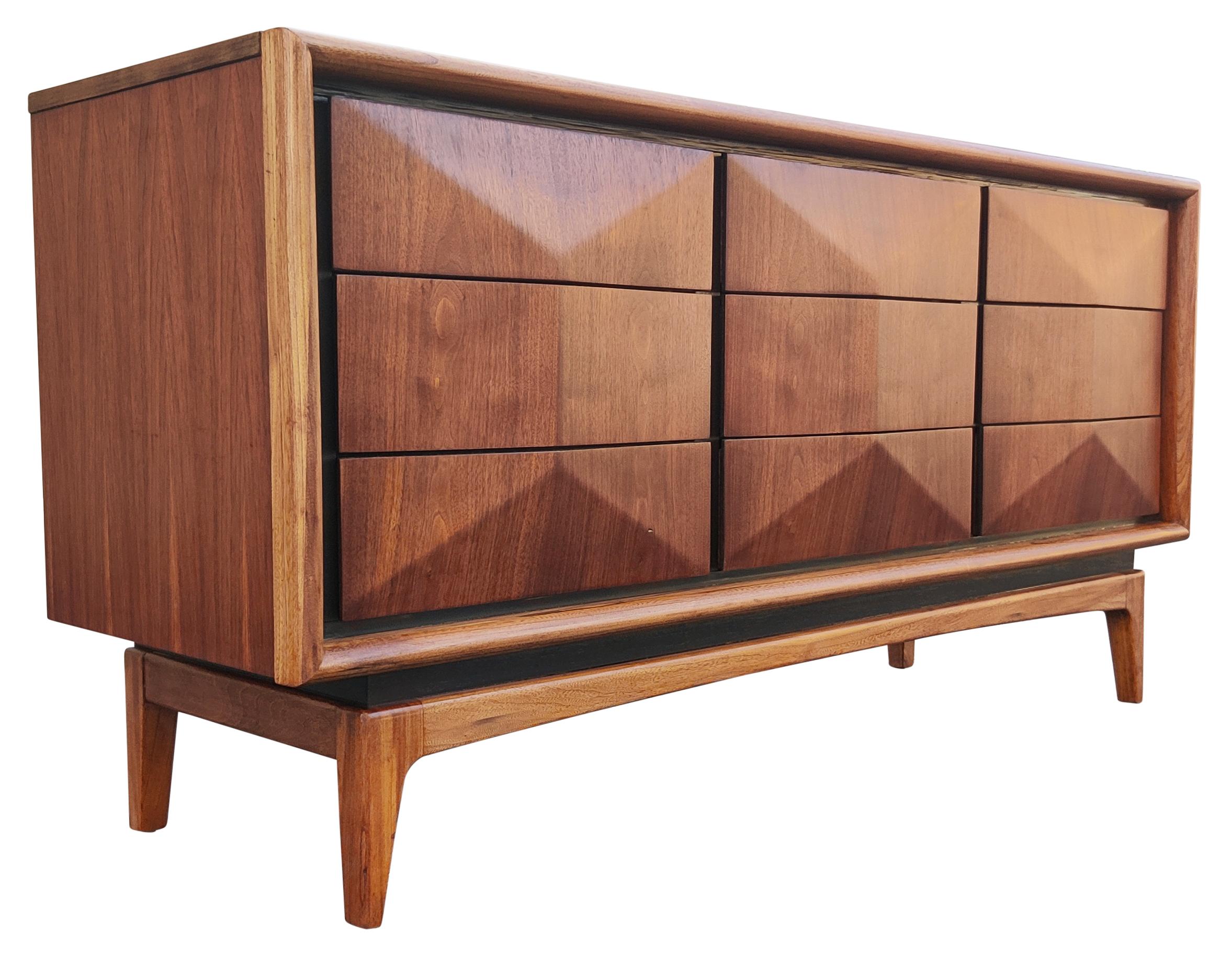 Description: Mid-Century Modern united furniture company vintage circa 1950s nine-drawer triple dresser would work well in the bedroom as originally intended or in the living room re-purposed as an entertainment console. The long, Danish style