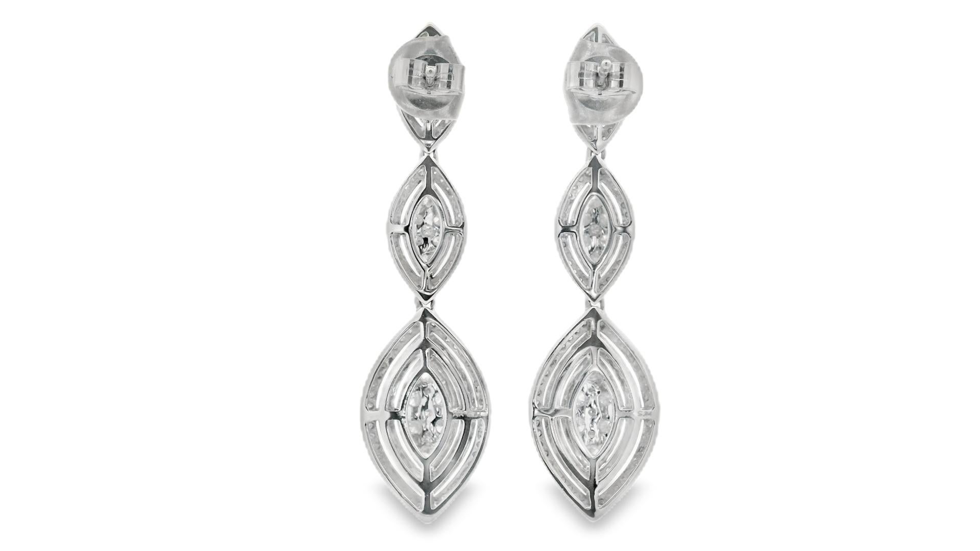 Crafted for brilliance and movement, these triple marquise drop earrings feature 316 round brilliant-cut diamonds totaling 3.00 carats, set in luminous 14K white gold. Each earring showcases three vertically aligned marquise-shaped clusters, framed