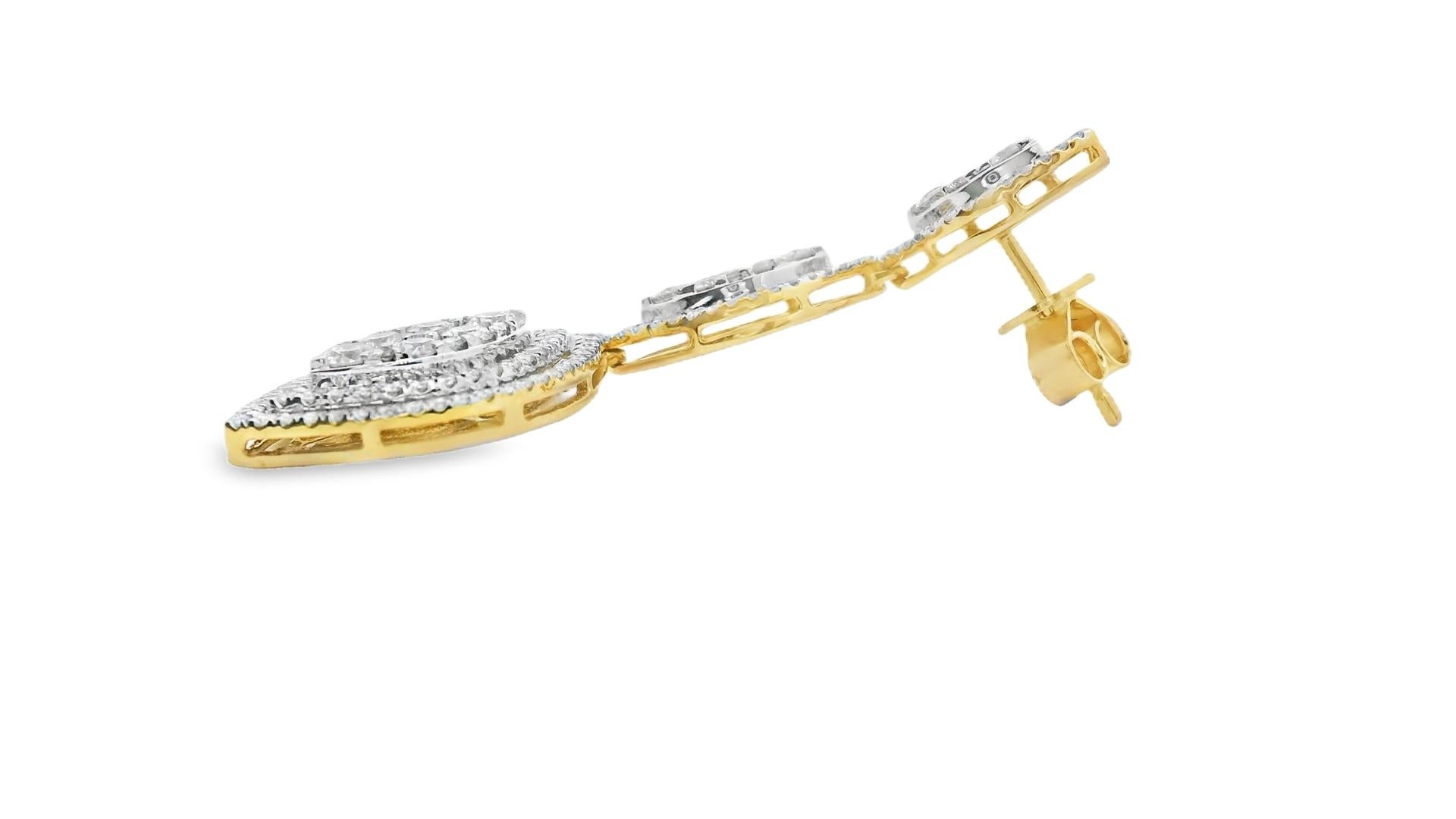 Elegant and meticulously detailed, these triple marquise drop earrings are crafted in 14K yellow gold and encrusted with 316 round brilliant-cut diamonds totaling 3.00 carats. Each earring features a trio of vertically aligned marquise-shaped