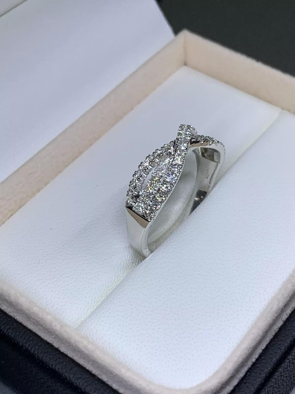 Round brilliant diamond twisted pave setting engagement ring wedding band in 18ct white gold.
Weight 5.2g
Diamond total weight 1.00ct F VS1.
Ring can be resized
Width 7mm upper
Box and valuation included

This stunning 1.00ct diamond eternity
