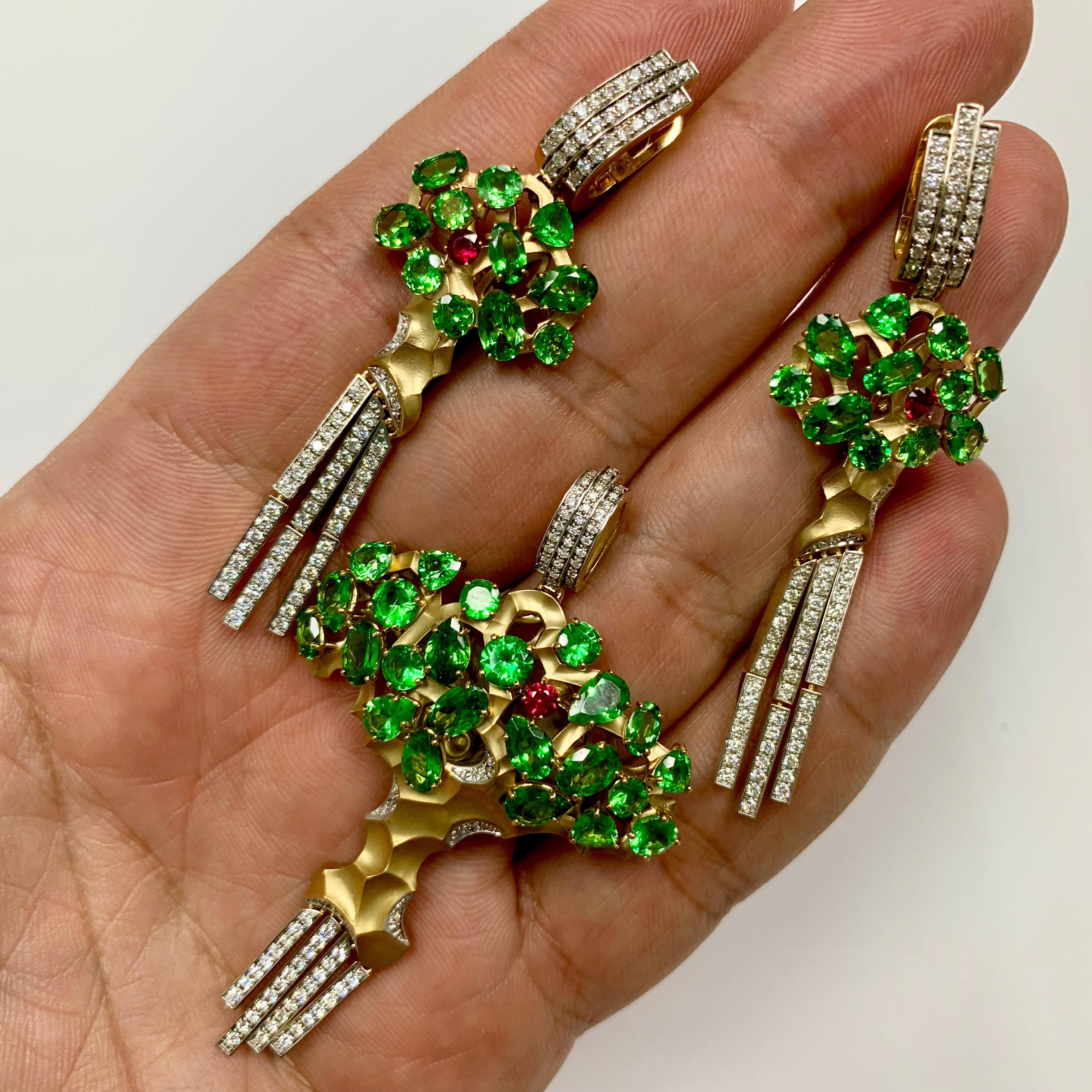 Diamond Tsavorite 18 Karat Yellow Gold Eden Tree Suite
Pendant and Earrings
Everybody knows the story about Eden Tree, the Story of Life. 
Now you also can see how It looks like. Tsavorites as the leafs, Ruby as the Apple and Diamonds Symbolised the