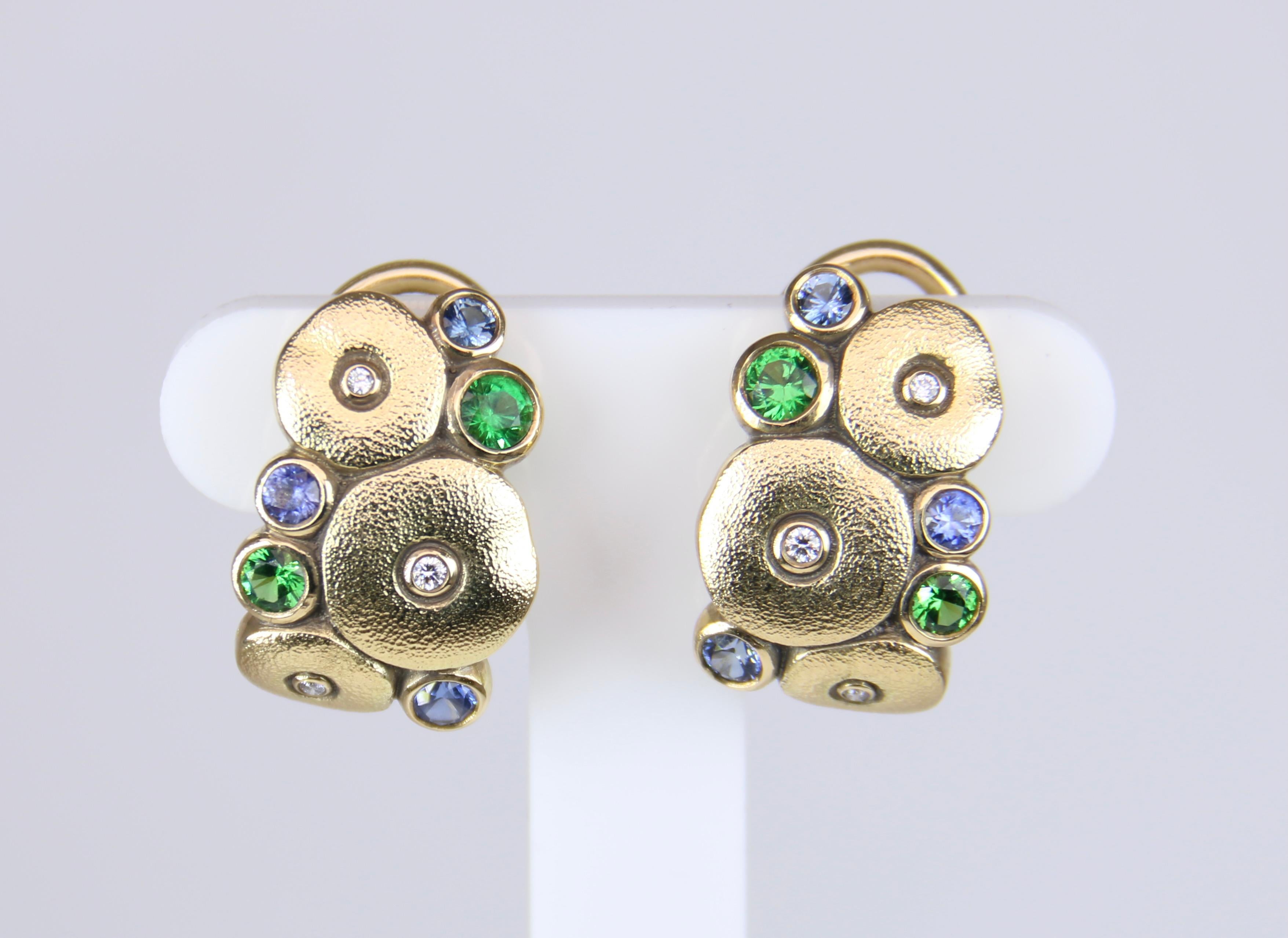 These “Orchard” earrings showcase 6 diamonds (0.04ct.) 4 tsavorite and 6 sapphires (0.60ct.) in 18k Gold. The “Orchard” collection from Alex Sepkus combines the beauty of Diamonds, Tsavorites, and Sapphires with effortless elegance.