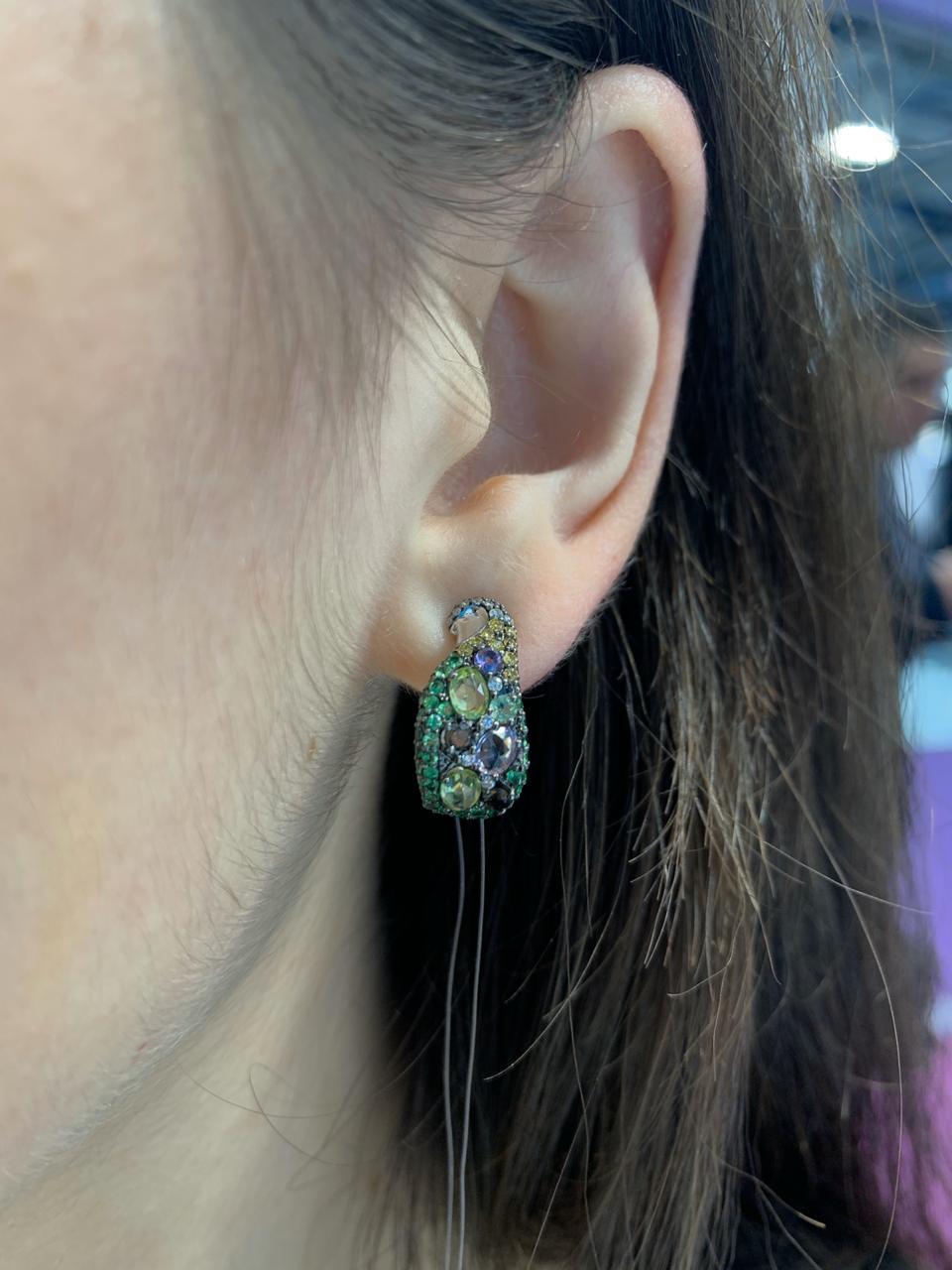 Irregular, soft drops of colourful garnet live accompanied by smaller, contrasting diamonds, quartz and chrysolite  creating a unique  masterpiece of fine jewellery.  Something completely unique and special-just like YOU!

Earrings 14 K White Gold