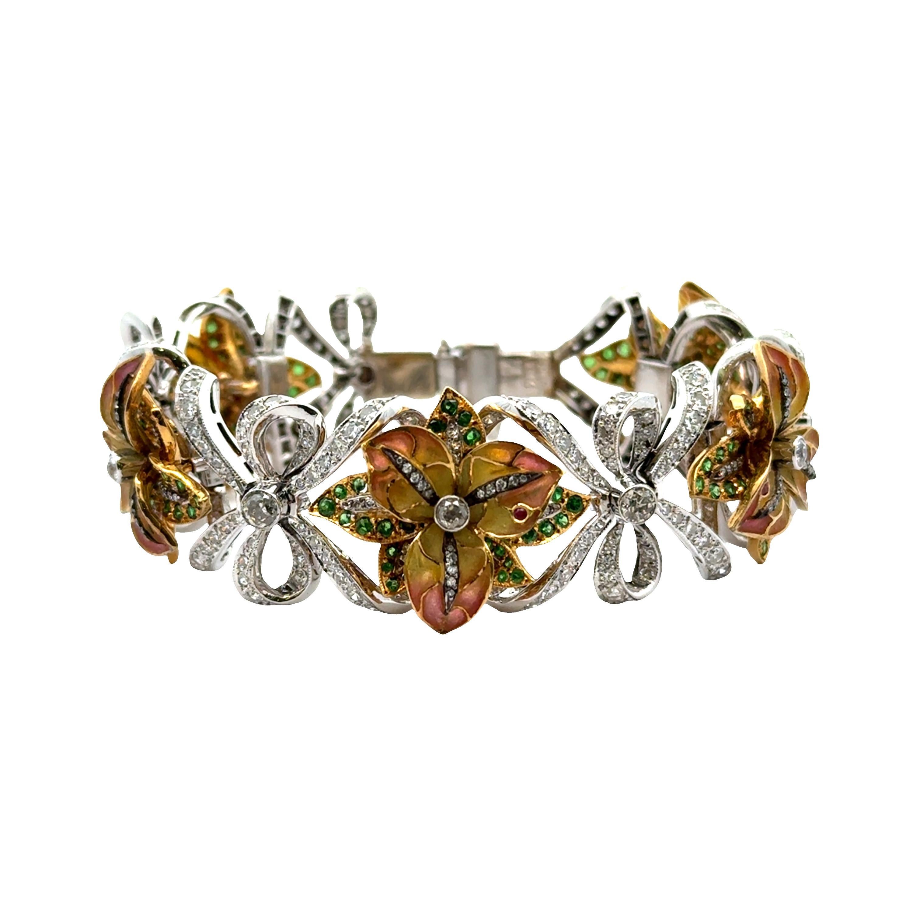 A contemporary link bracelet, featuring an intricate floral design. The bracelet is adorned with round-cut white diamonds totaling approximately 6.00 carats, providing a brilliant sparkle. Accentuating the design are round-cut green tsavorites