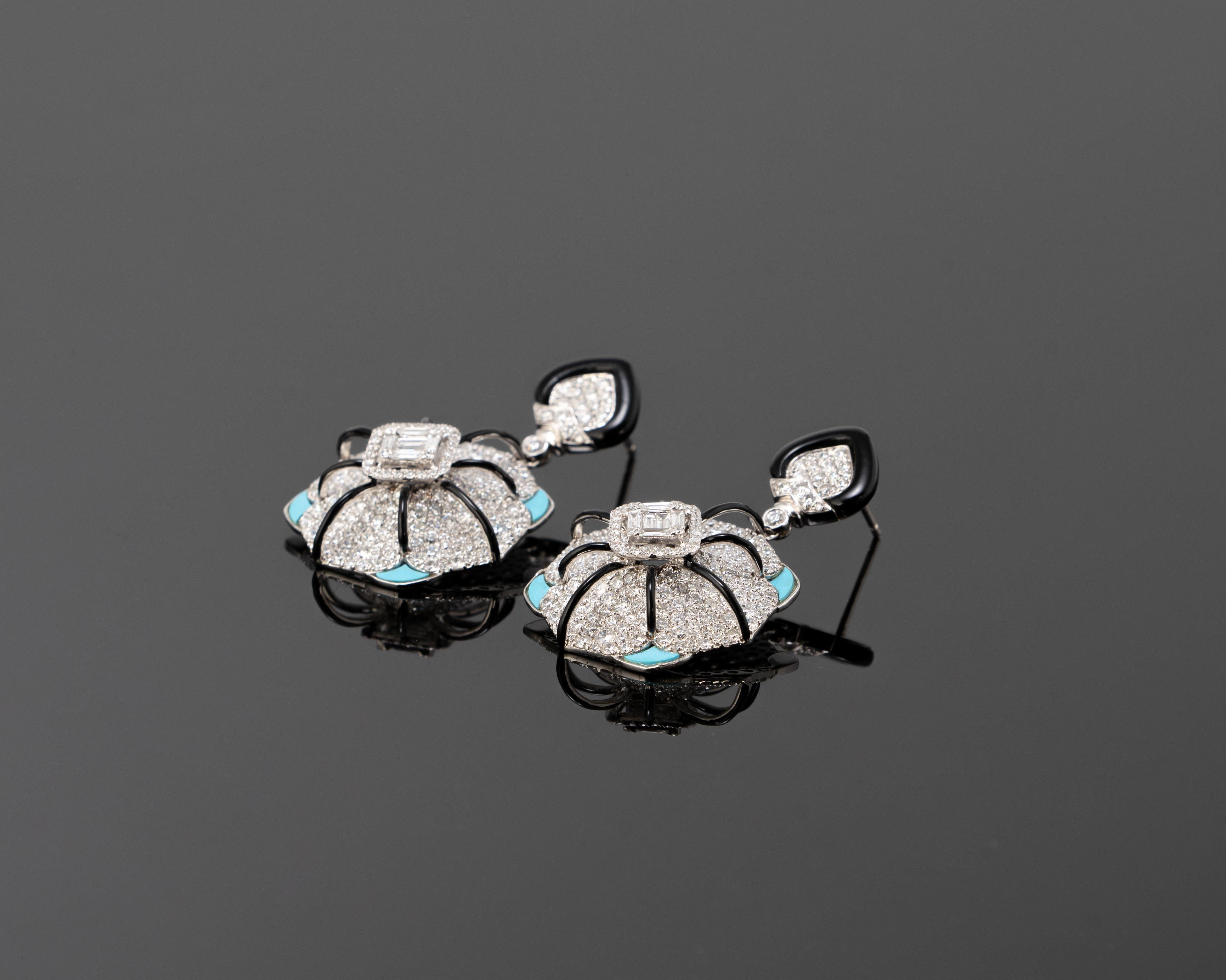 A stunning pair of Art-Deco earrings, studded with 7.5 carat VS quality White Diamonds, Turquoise and Black Onyx set in 18K White Gold. 
