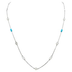 Collier station double infinity en or blanc 14 carats, perles de diamants et turquoises