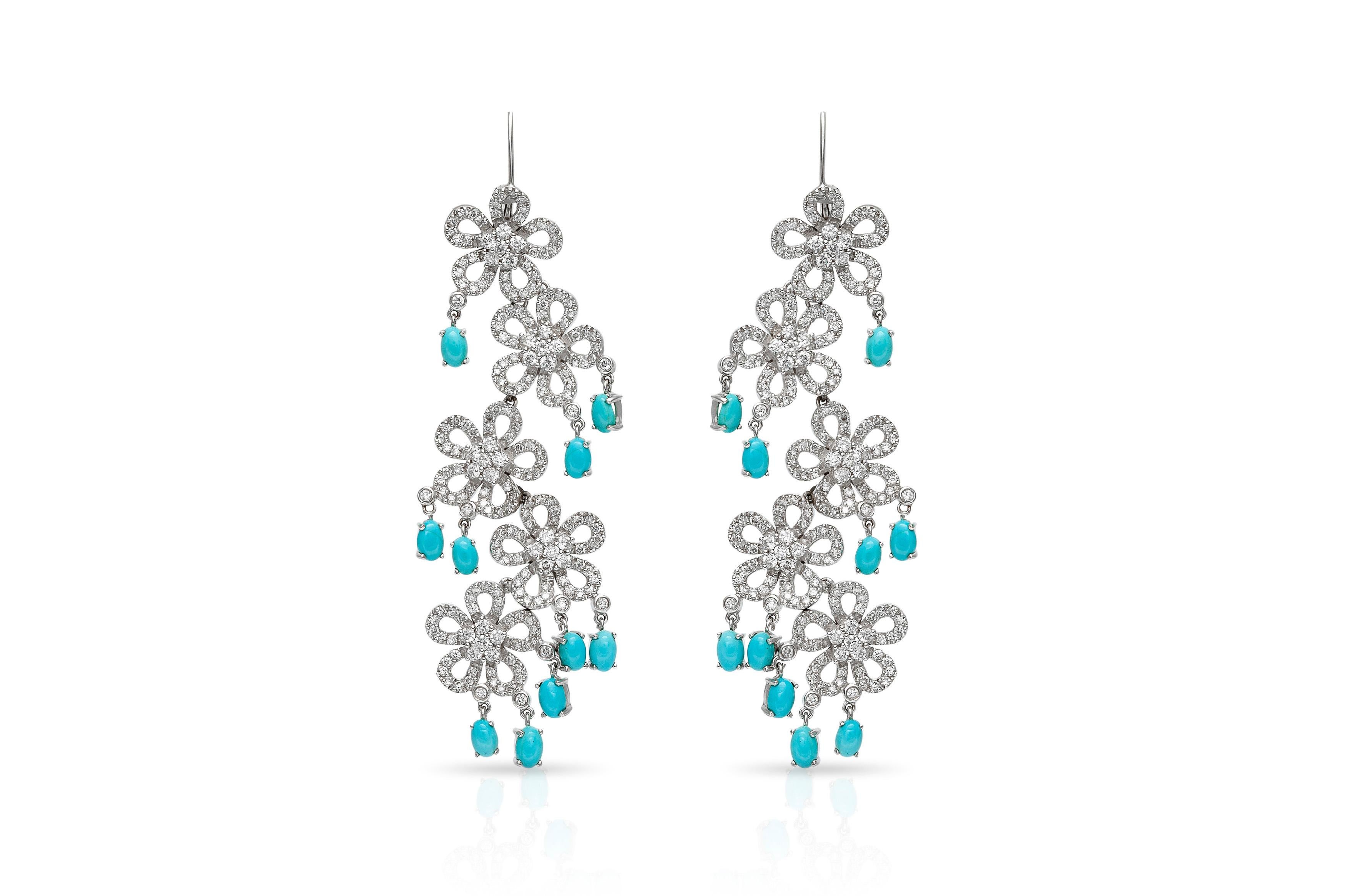 Earrings, finely crafted in 18k white gold with diamonds weighting approximately a total of 5.10 carats and turquoise weighting a total of 4.93 carats. Circa 1980's.