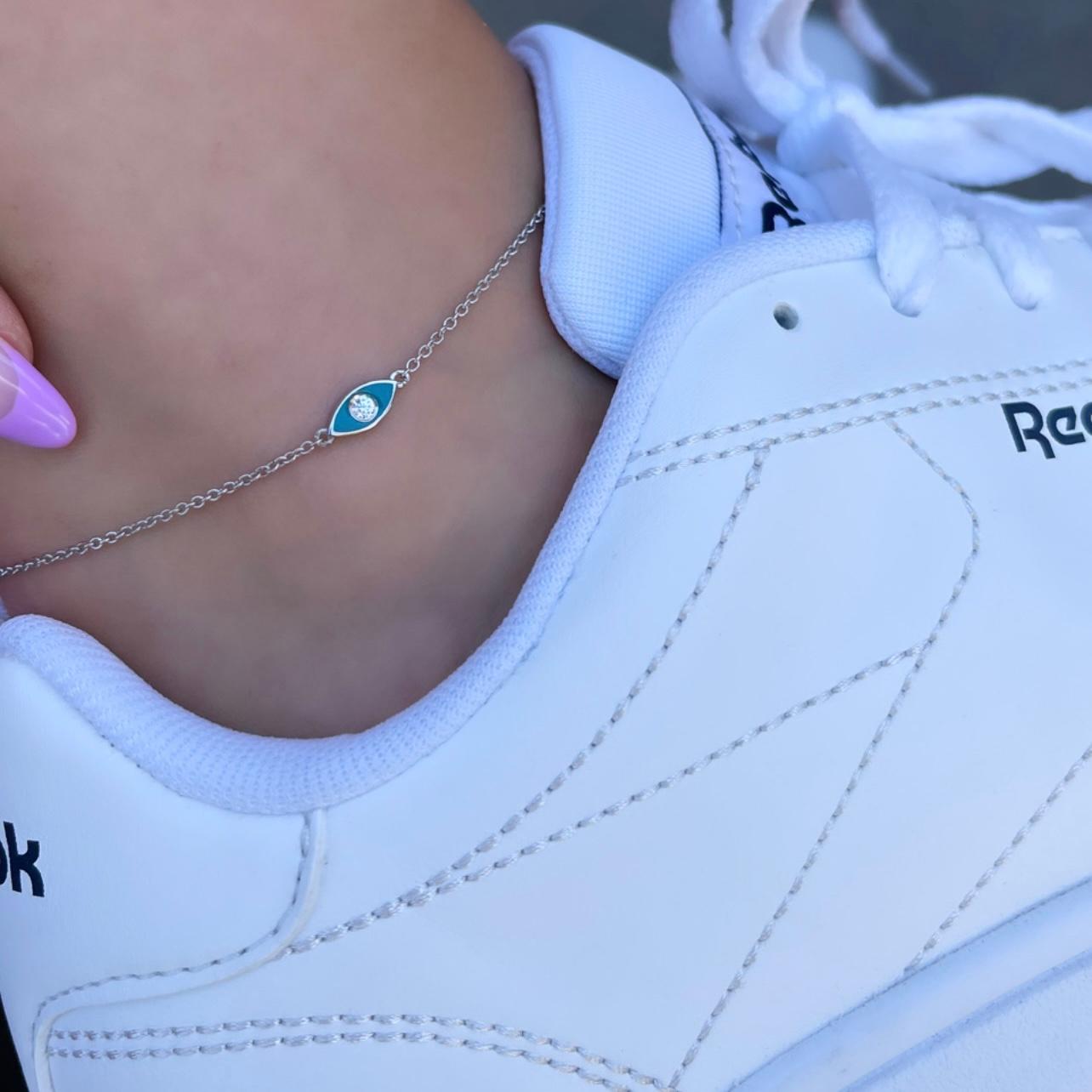 Diamond Turquoise Enamel Evil Eye Anklet in 14 Karat White Gold -Shlomit Rogel

Dazzling and elegantly timeless, this dainty turquoise enamel evil eye ankle bracelet will steal your heart. Crafted from 14k solid white gold and embellished with a