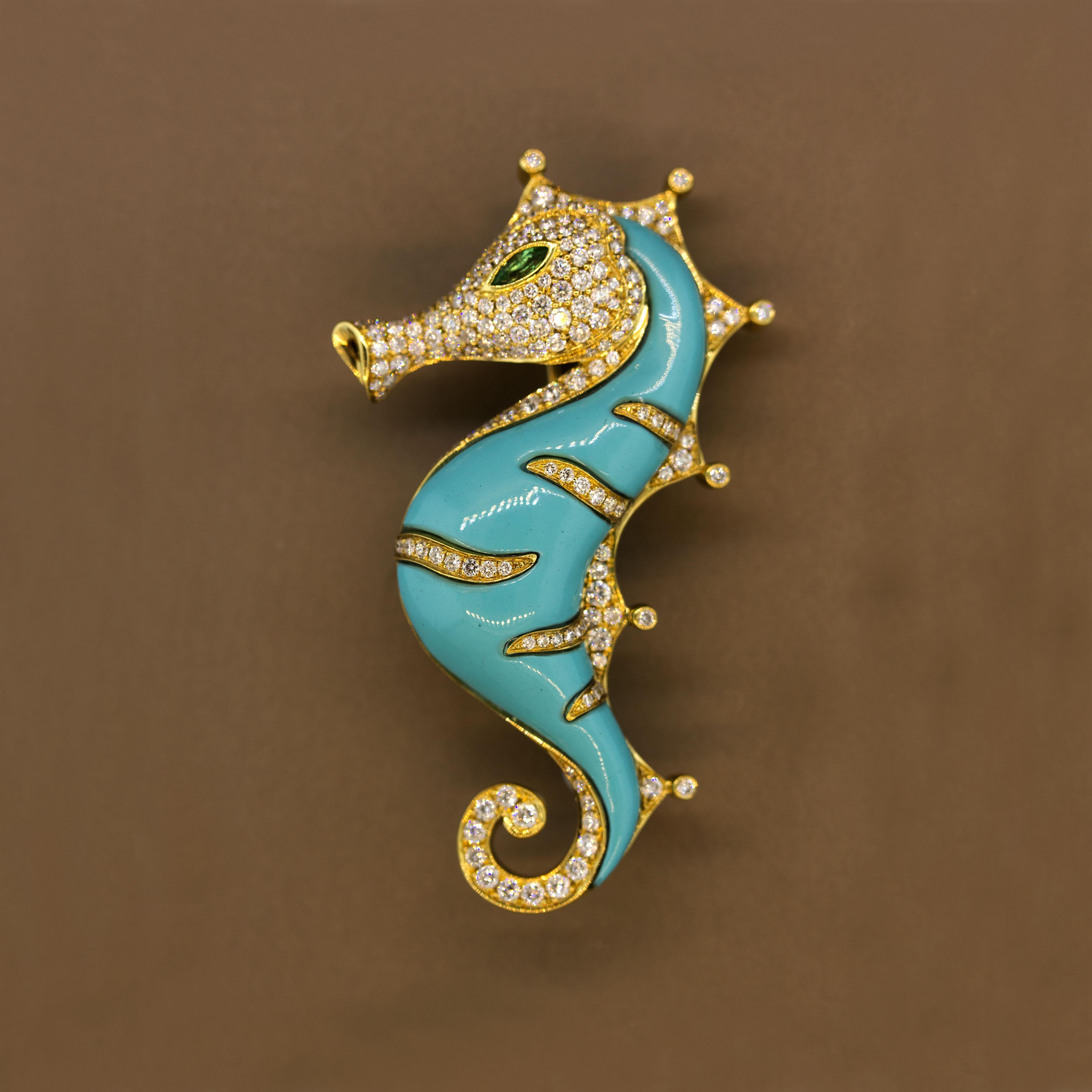 A stunning and realistic seahorse brooch! It features 1.59 carats of round brilliant cut diamonds which accent the seahorse. Its body is made of a bright hand carved greenish-blue turquoise which matches its natural shape. It has a peridot eye