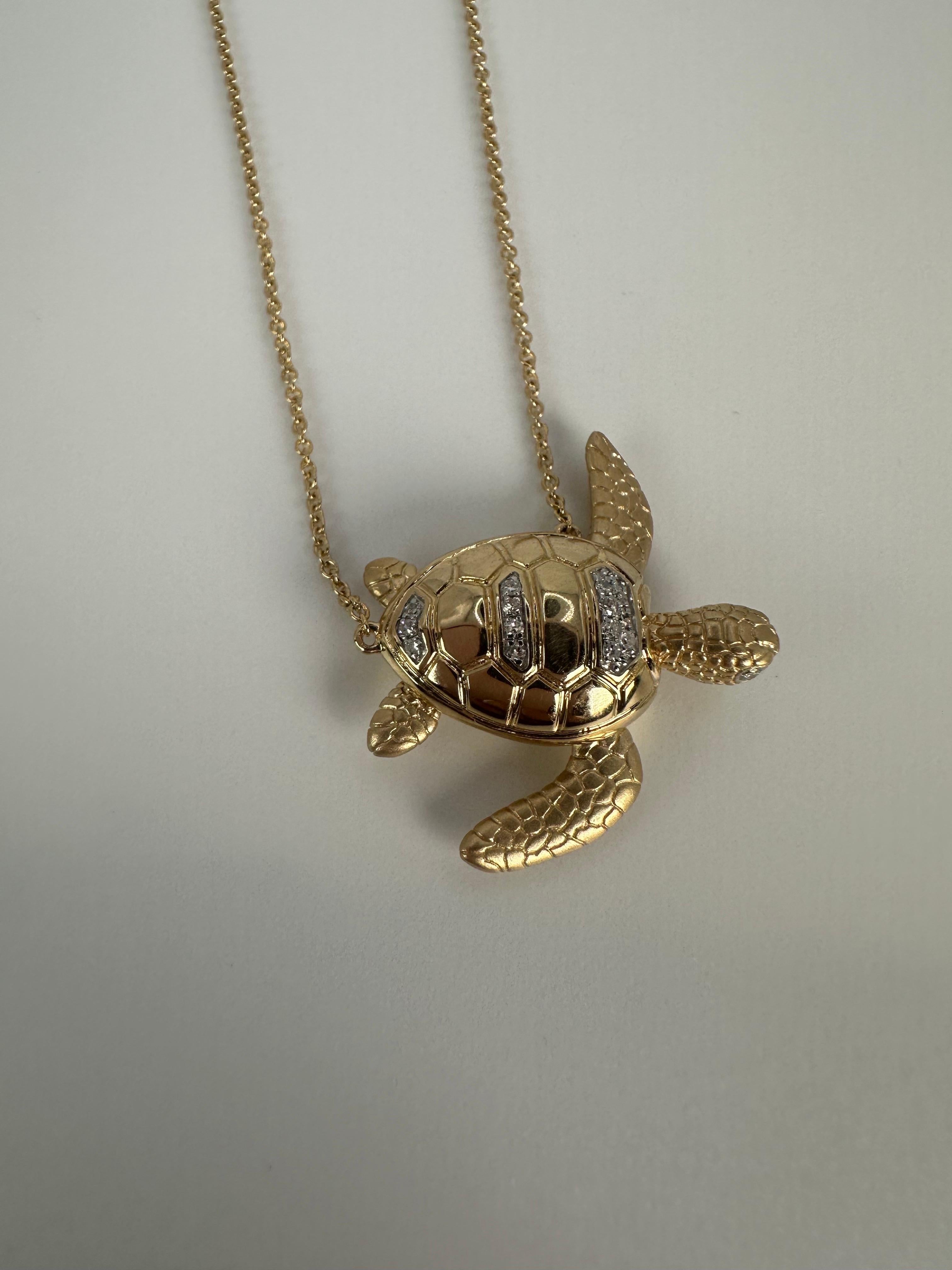 Natural diamonds turtle, movable all throughout and made in 14KT gold. Diamonds totaling 0.11 carats VS-SI clarity and G color. Turtle pendant necklace weight 8.4 grams.

Comes with beautiful packaging, certificate of authenticity and fast