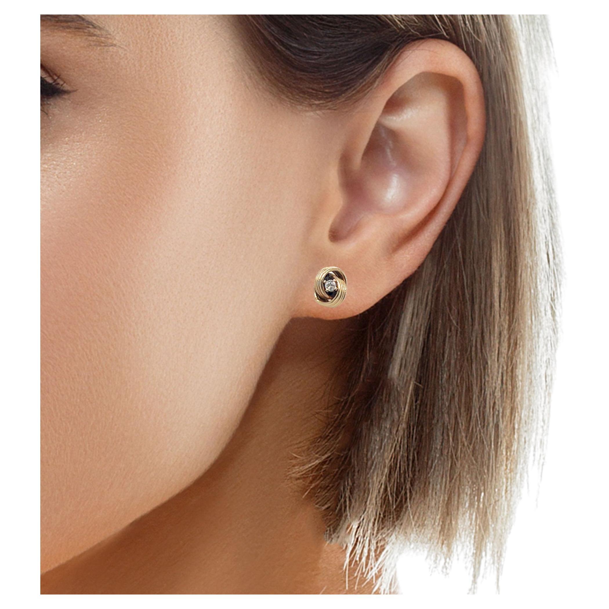 These 14k gold twist love knot stud earrings are a beautiful symbol of love and connection. Featuring delicate intertwining designs, each earring is adorned with sparkling diamonds that add a touch of brilliance.

Design: Twist love knot with
