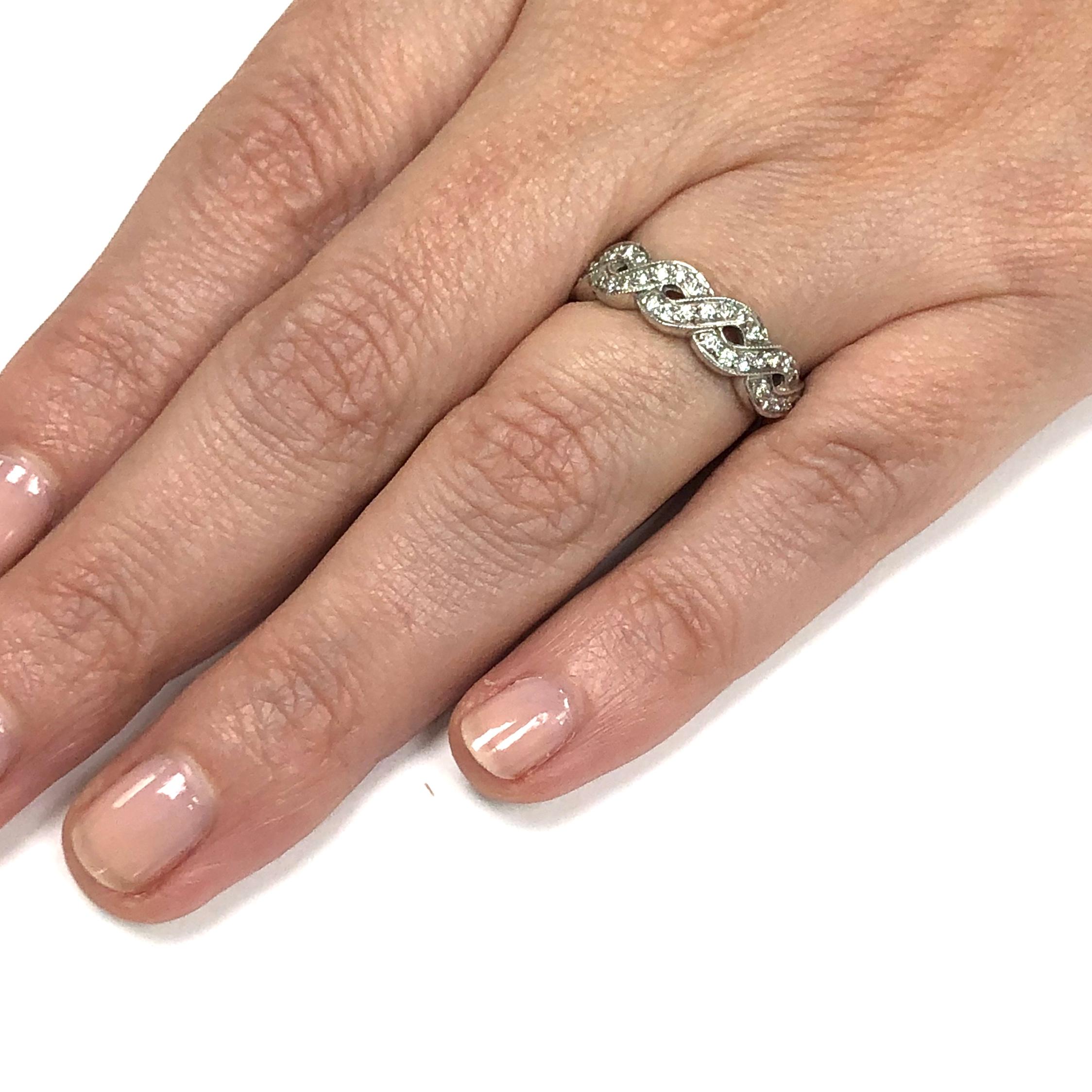 A beautiful twist of diamonds going halfway around the finger in a size 6 and 5.5 millimeters wide. Can easily be sized. If you don't see something, say something! We are a custom jewelry manufacturer in the heart of the Diamond District in New York