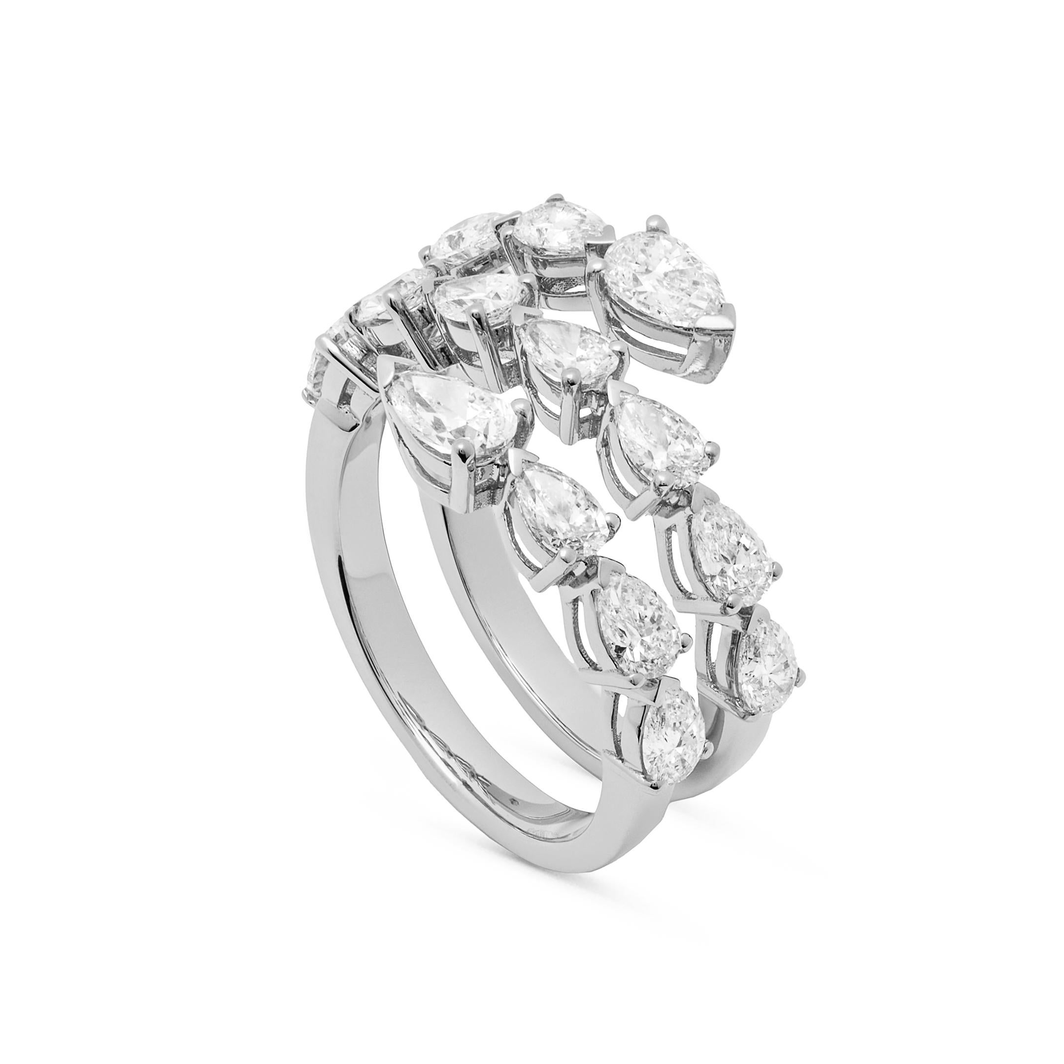 Three rows of sparkling diamonds comprise the Diamond Twist White Gold Ring. Stunning pear-shaped stones set in 18-karat white gold wrap elegantly around the finger. Wear your ring with denim, heels and your favorite Hermés bag for the perfect,