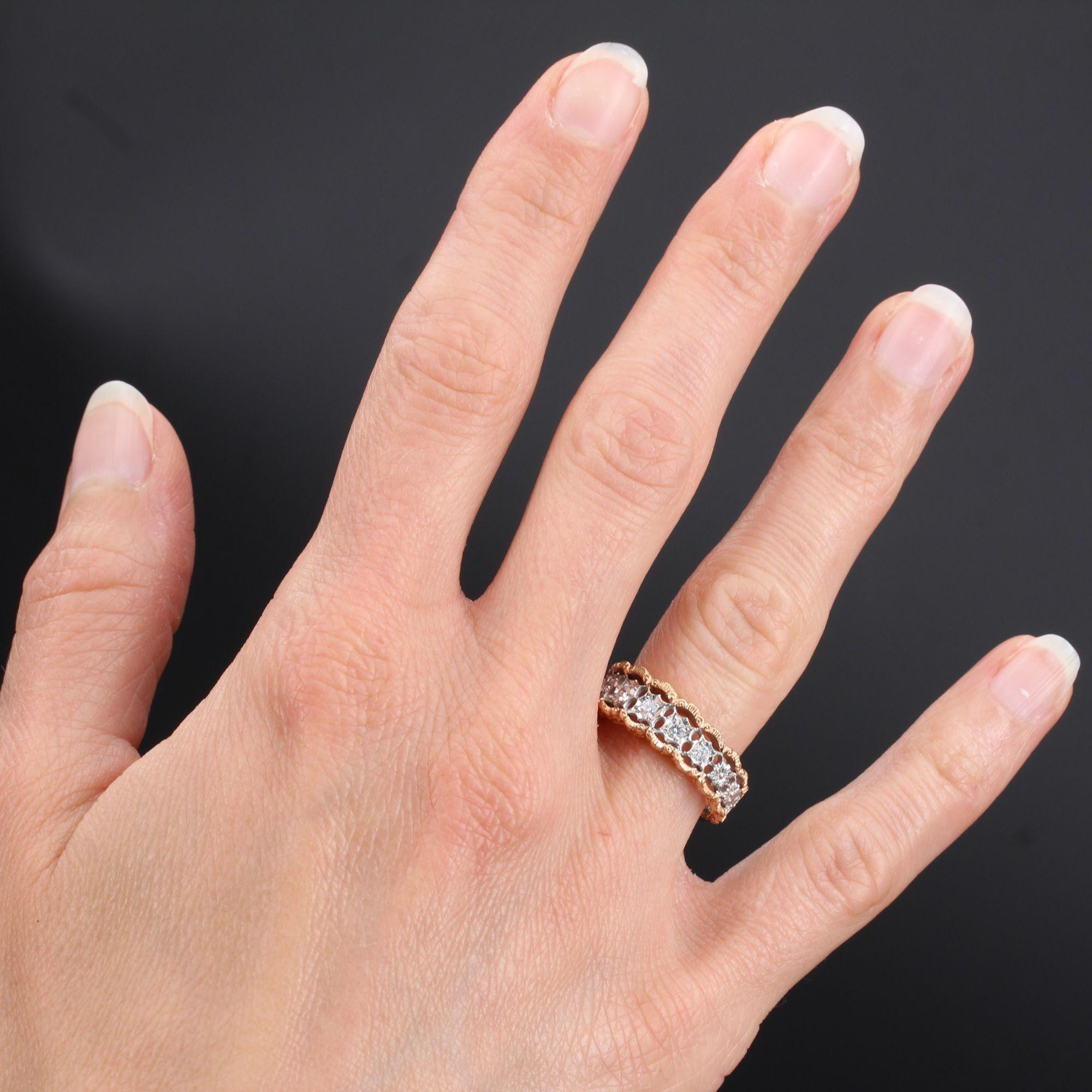 Ring in 18 karat rose and white gold.
This ravishing diamond ring features delicate white gold filigree work set with seven brilliant- cut diamonds edged with rose gold filigree. A delightful ring that would make an elegant eternity ring. 
Total