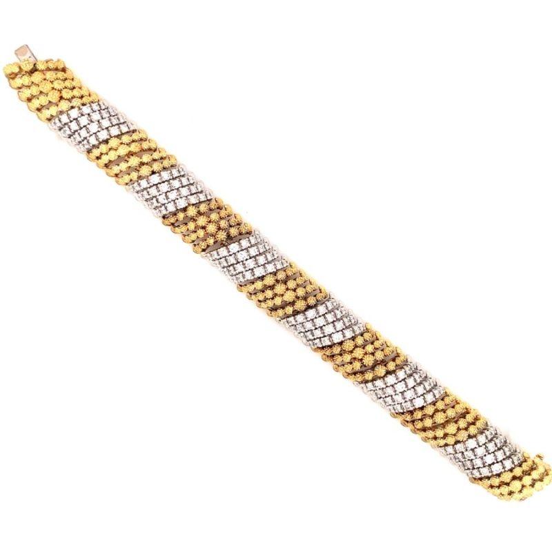 One diamond two-tone 18K yellow and white gold bracelet with a flexible make and textured gold beadwork featuring 168 round brilliant cut diamonds totaling 6 ct. Circa 1960s.

Gorgeous, striking, pristine.

Additional information:
Metal: 18K yellow