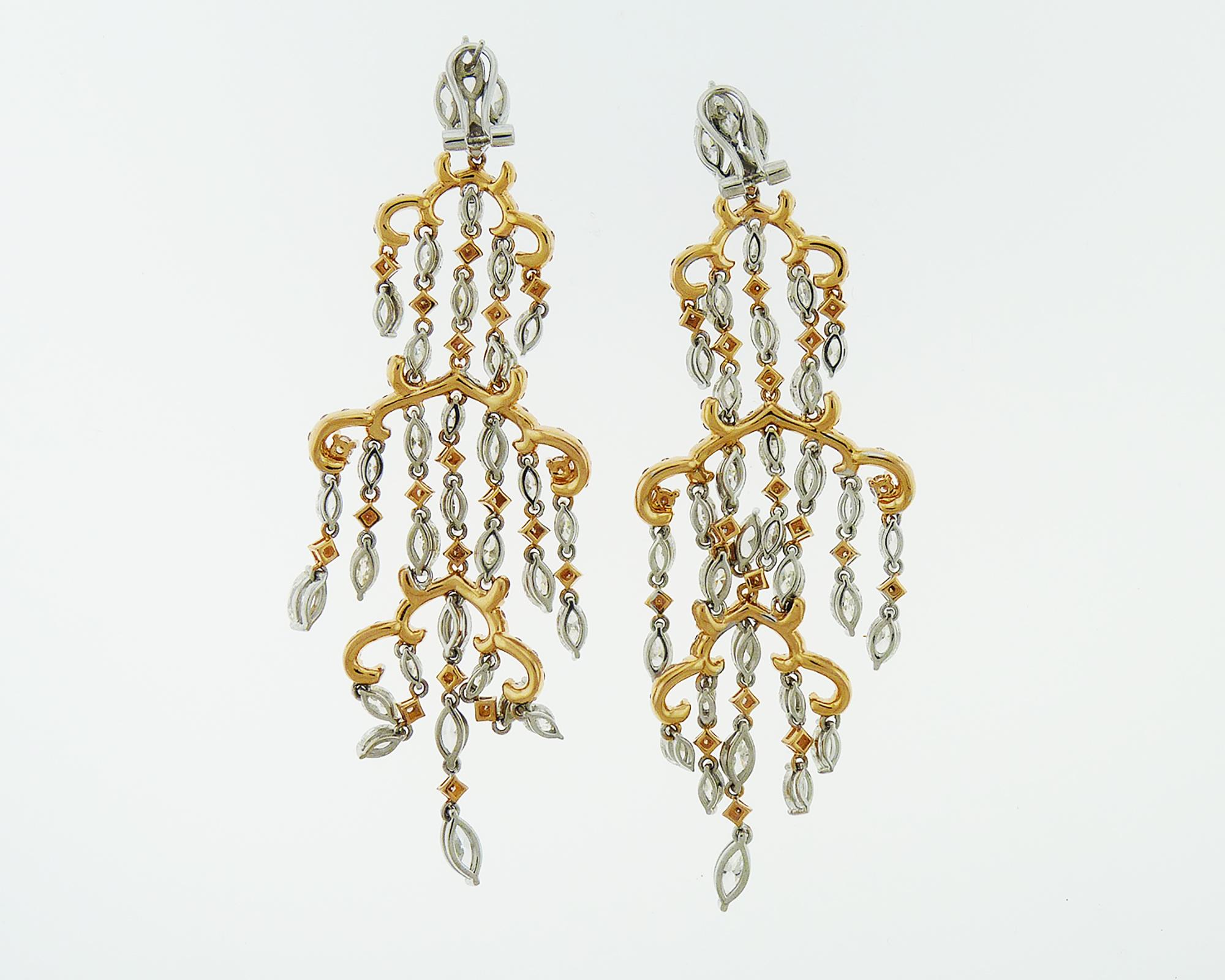Stunning chandelier earrings featuring marquise and round diamonds weighing 20 carats total. The diamonds are equivalent to F-H colors, VS-SI clarity and mounted in white and rose gold. 
Weight of the earrings is 32.53 grams.
More pictures are