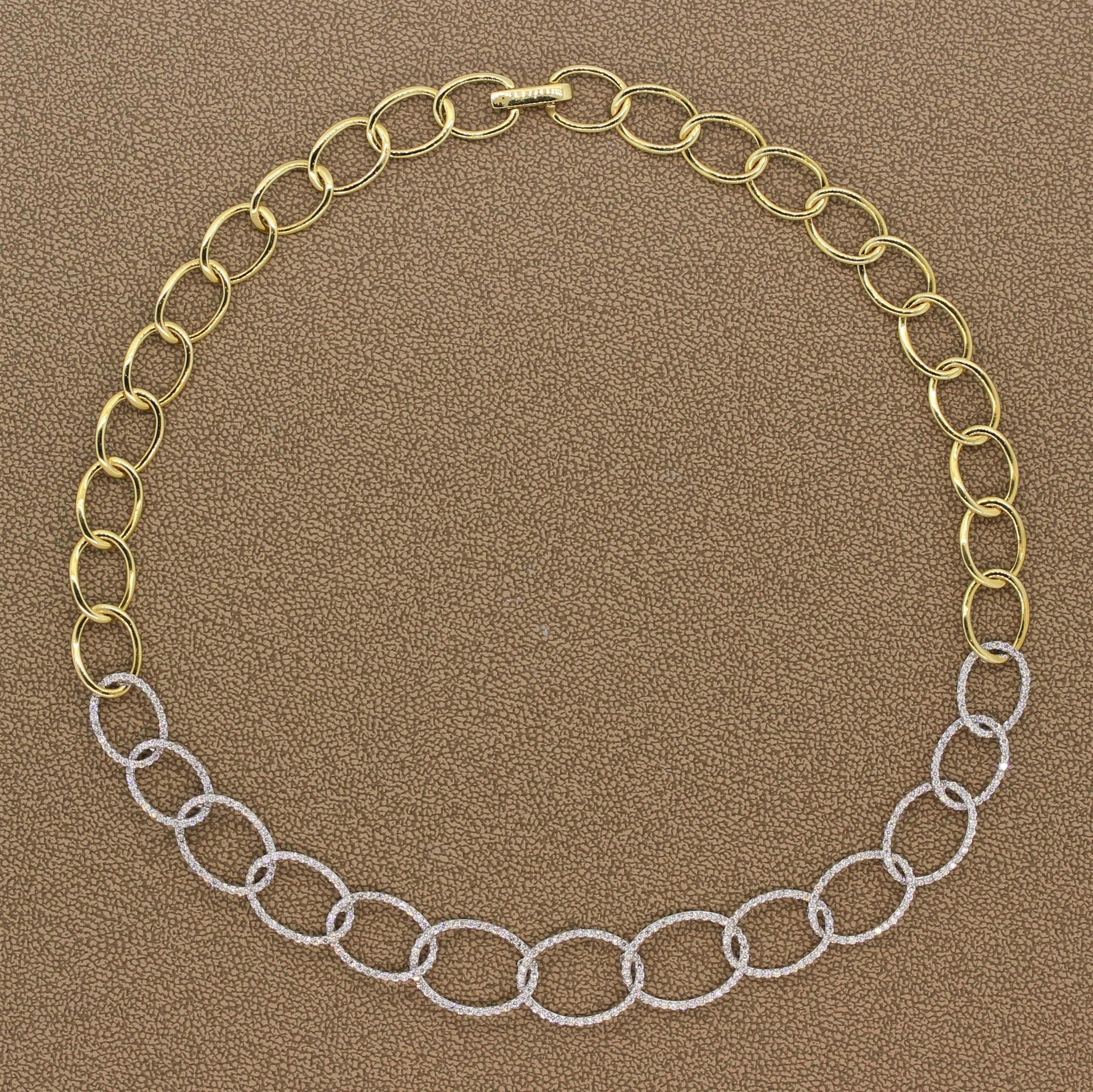 This fun necklace featuring 3.06 carats of VS quality diamonds has great movement. The round cut diamonds are set in graduating 18K white gold oval hoop links with 18K yellow gold oval hoop links connecting the two sides of the necklace. A fun piece