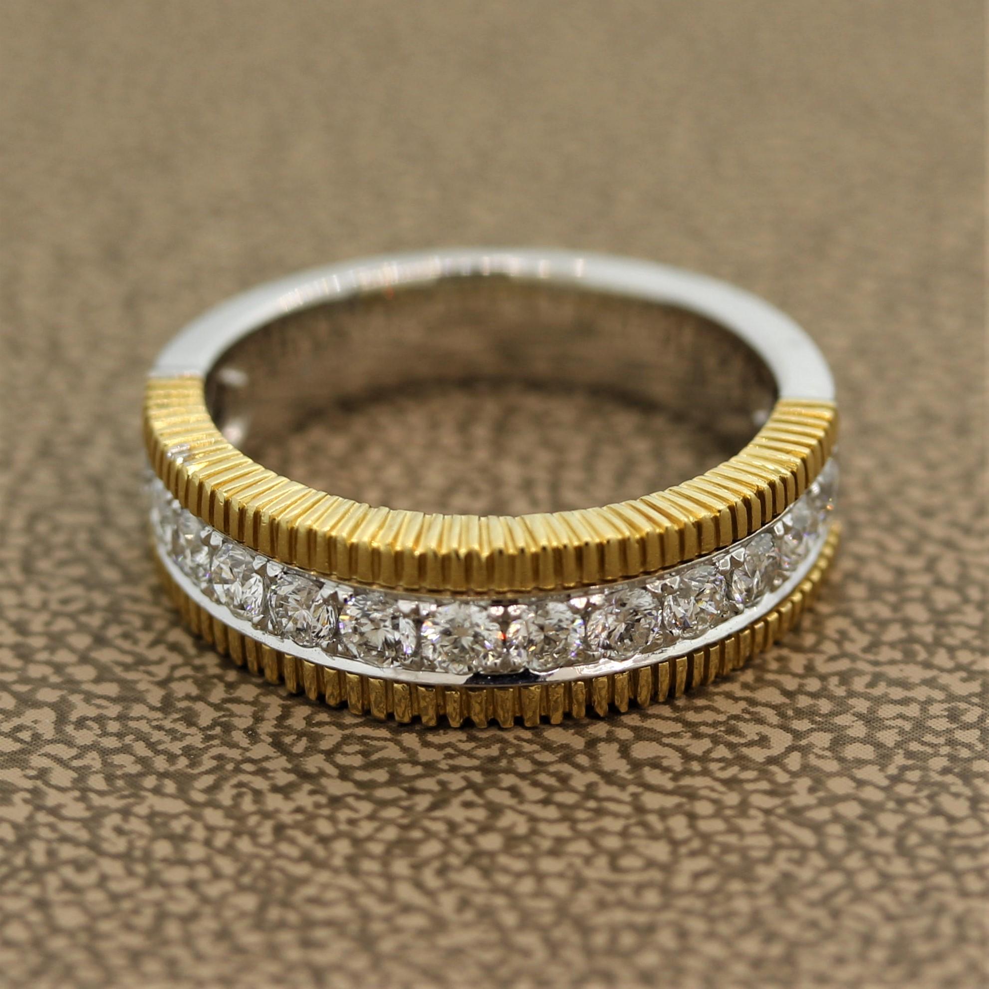 One of my favorite diamond bands in our collection, this particular piece is made of both 18k white and yellow gold. It features 0.73 carats of round brilliant cut diamonds set in 18k white gold with a yellow gold carved border. Ready to be worn