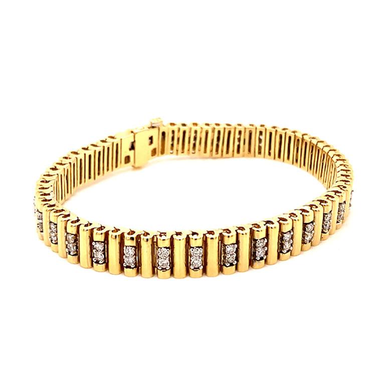 Gorgeous unisex Diamond bracelet in 14k yellow gold. This beautiful bracelet features 66 round brilliant cut natural diamonds each set in four prongs. The diamonds are G to H in color and SI1 to SI2 in clarity. The total weight of diamonds is