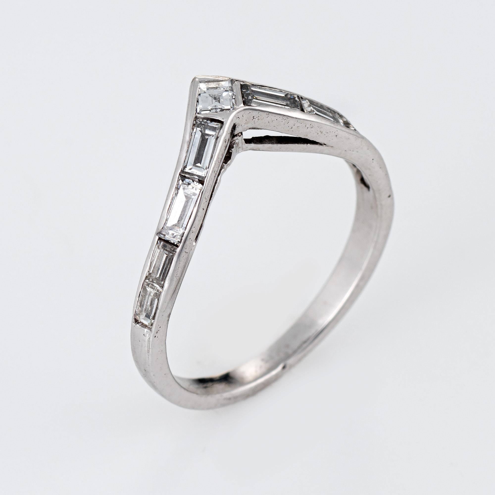 Stylish vintage diamond 'V' band (circa 1960s to 1970s) crafted in 900 platinum. 

Straight baguette & emerald cut diamonds total an estimated 0.50 carats (estimated at H-I color and VS2-SI1 clarity). 

The V shaped ring is set with baguette cut