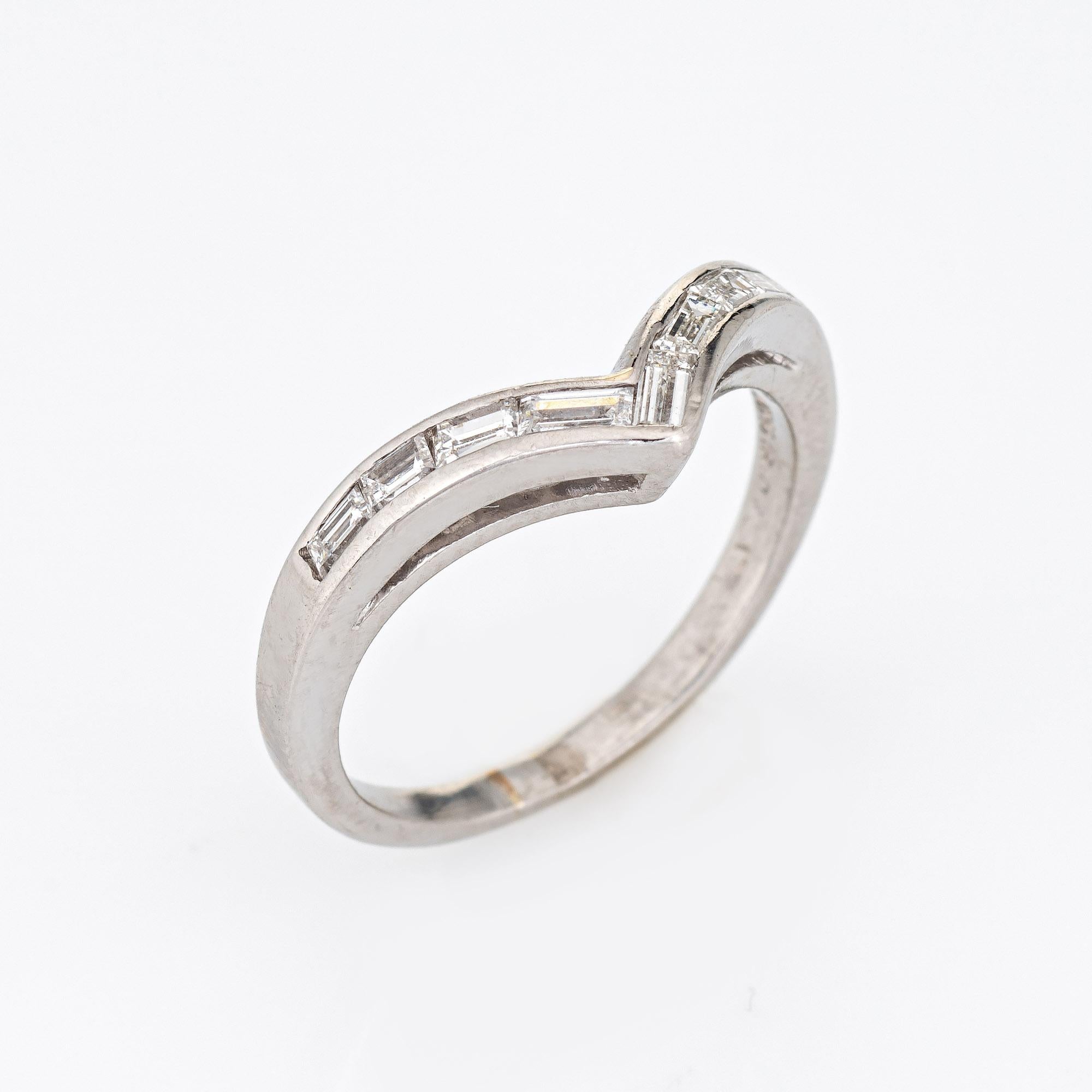 Stylish vintage diamond 'V' ring crafted in platinum (circa 1950s to 1960s). 

8 straight baguette cut diamonds total an estimated 0.40 carats (estimated at G-H color and VS2-SI1 clarity). 

Set with bright white sparkling diamonds the 'V' ring is