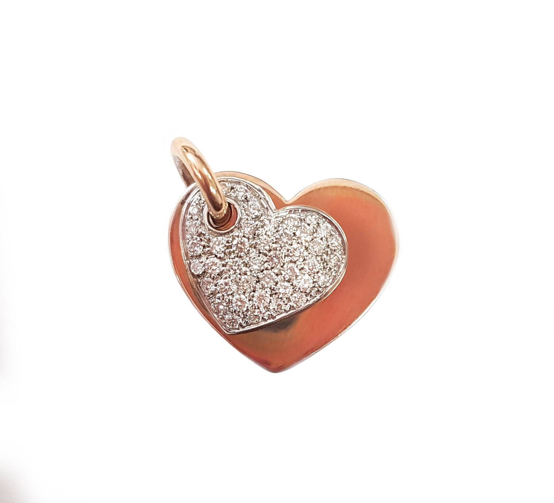 This is an 18-karat rose and white gold heart-shaped pendant; the white gold is pavé-set with white diamonds. 

The pendant is 2 centimetres wide and 2.3 centimetres long. Add it to any rose gold chain to match the finding (bail). 

Are you looking