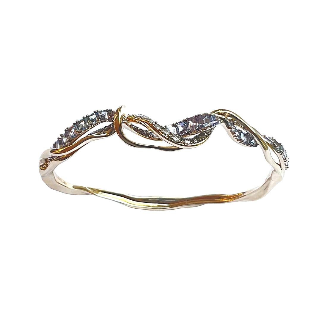 The Diamond Vapour Bangle, fashioned in 18k white gold, is a graceful piece that recreates the look of intertwining swirls of smoke. As if a sinuous wisp of smoke had wrapped itself around the wrist, the bangle’s finely sculpted form twists and