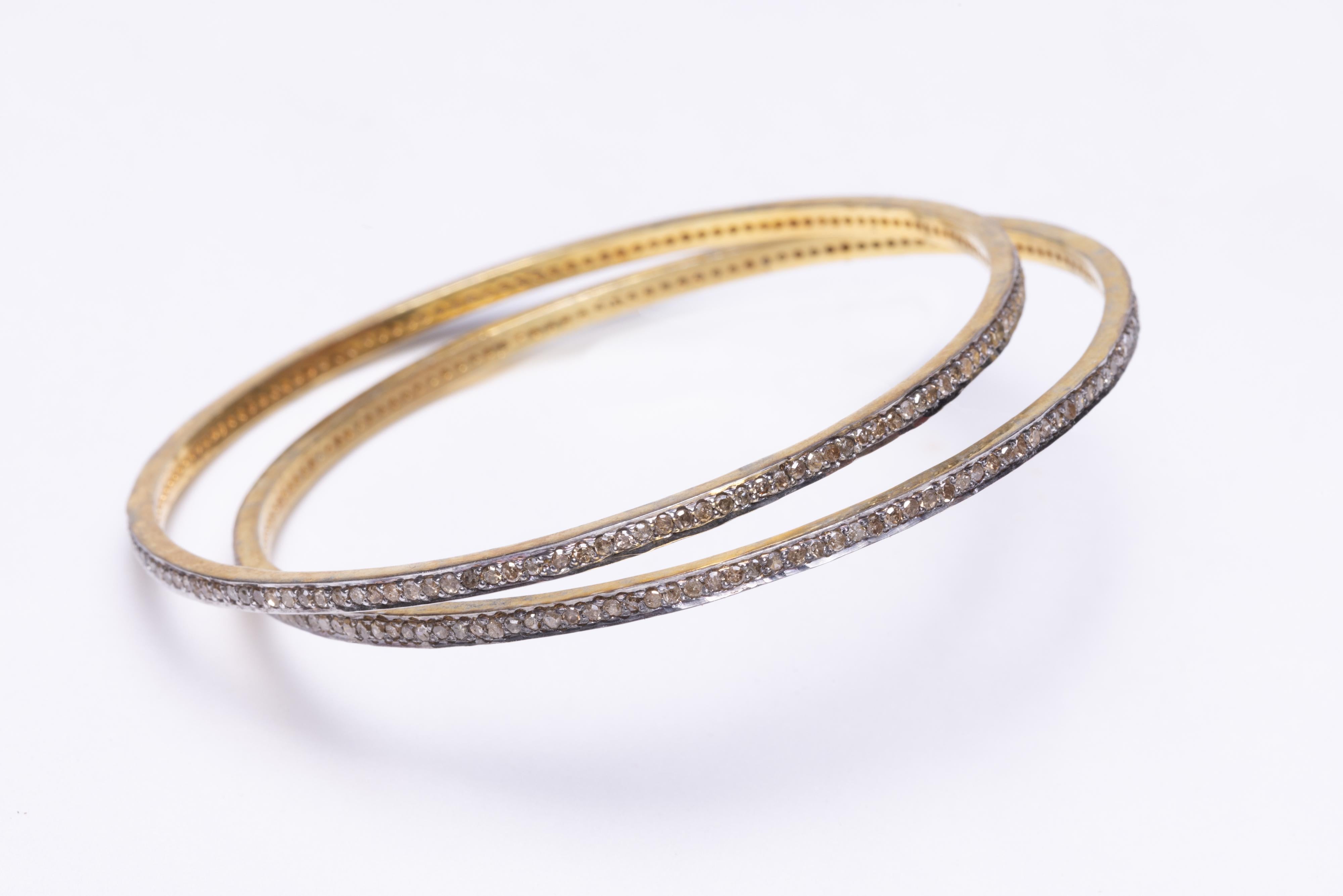   These pave`set diamond bangles can be worn alone, as a group or with other bracelets in your collection.  They slip over the hand and the inside circumference is 7.5