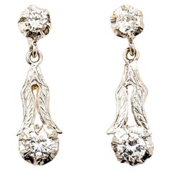 Boucles d'oreilles pendantes vintage en or bicolore avec diamants