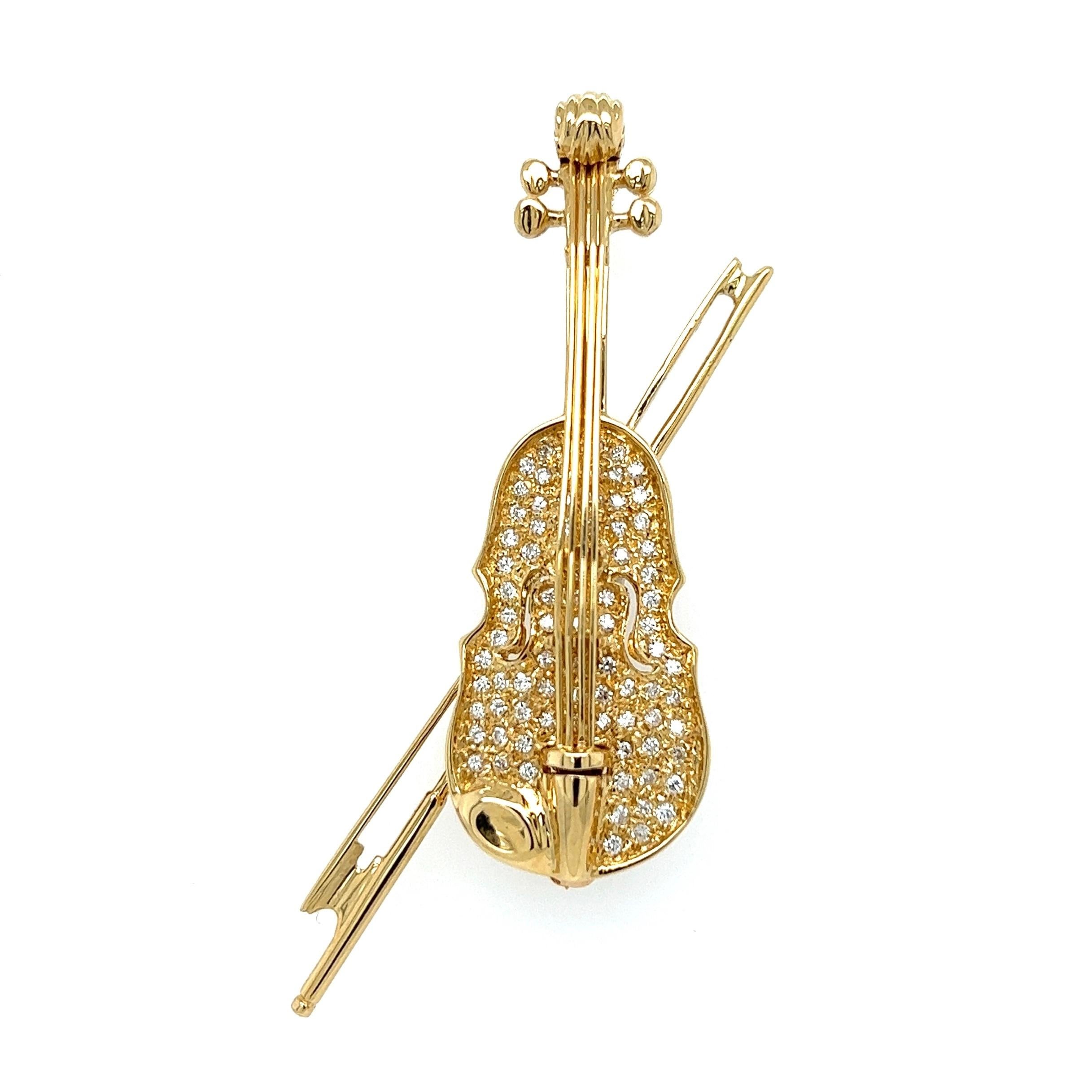 Simply Beautiful! Diamond Violin and Bow Gold Brooch Pin. Hand set with Pave Diamonds, approx. 0.55tcw. Hand crafted in 18K Yellow Gold. Measuring approx. 2.25” H x 1.00” W. More Beautiful in real time! Chic and Timeless…Sure to be admired, a piece