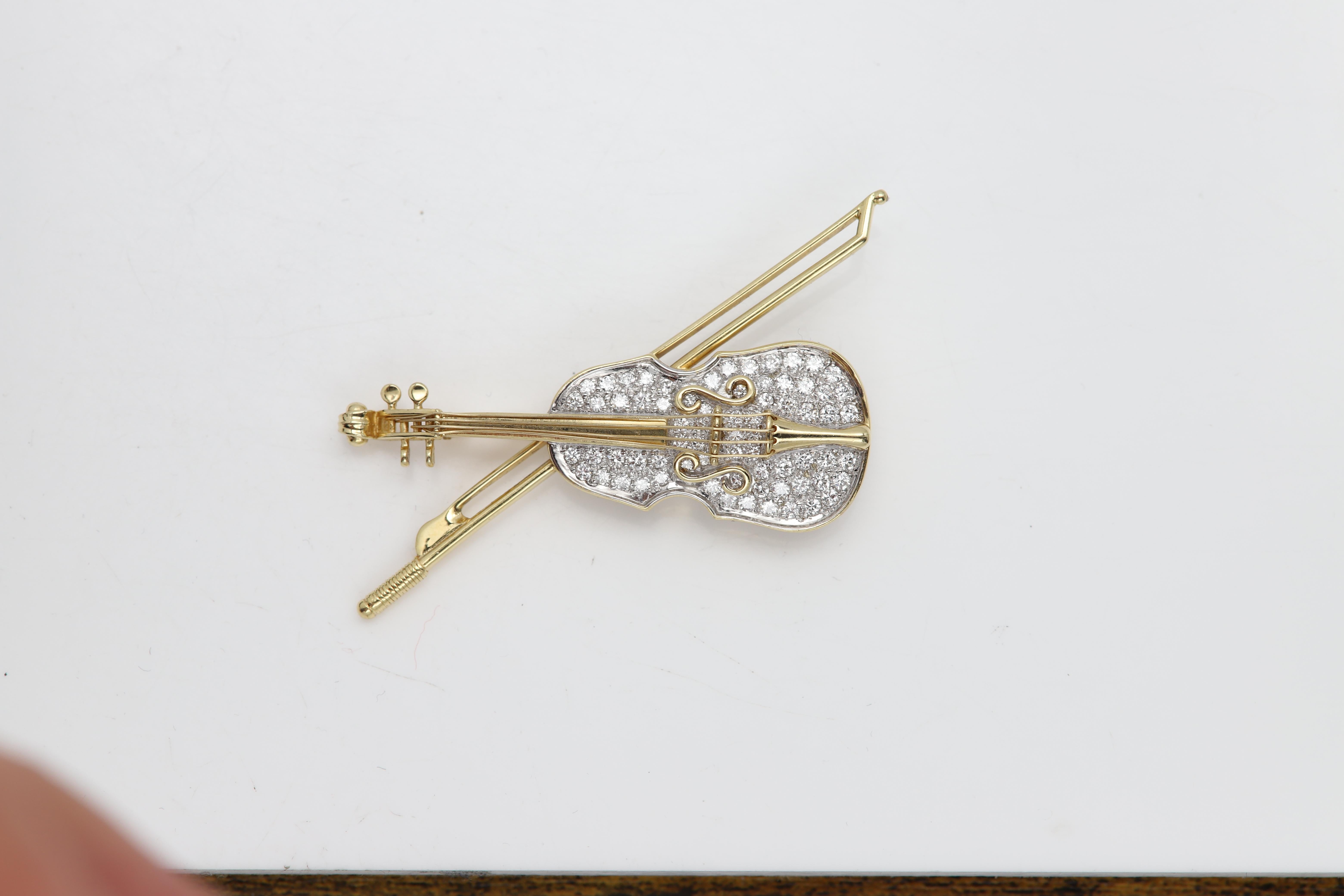 Vintage Brooch pin miniature Violin
14k Gold and natural Diamonds
Circa 1960's pre-owned - as new condition
Approx Total Diamonds 2.0 carat. G-H-SI
White & Yellow Gold approx 10.40 grams
Size 1.75' inch (or 45mm)
Was bought at a Connecticut estate