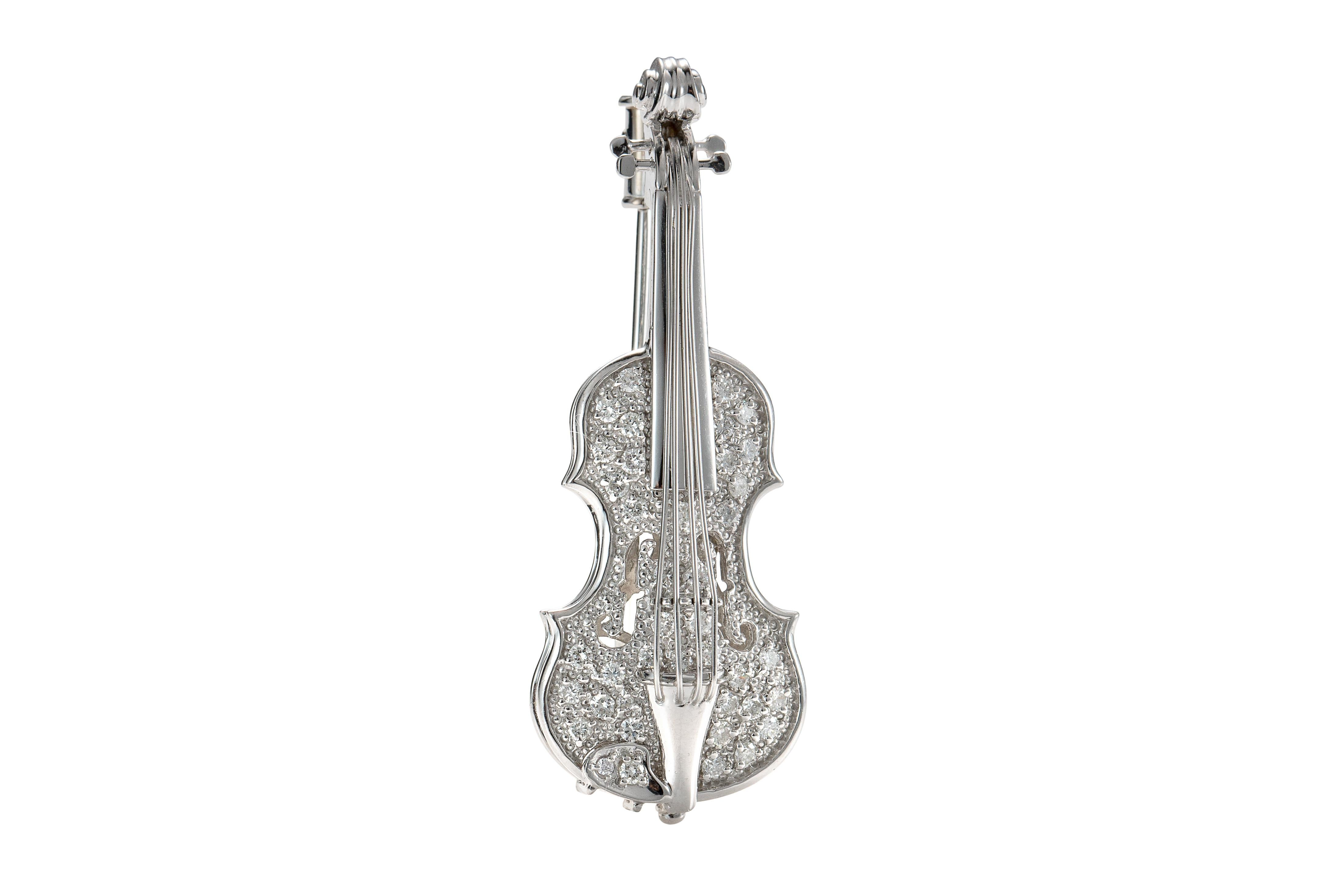 Item Details:
Metal type: 18 karat white gold
Weight: 10.3 grams
Measurement: 1.75 inch length x 2.5 inch width 

Diamond Details:
Cut: Round
Carat: .35 carat total weight
Color: G-H
Clarity: VS-SI

This is a beautiful Violin pin / brooch from the