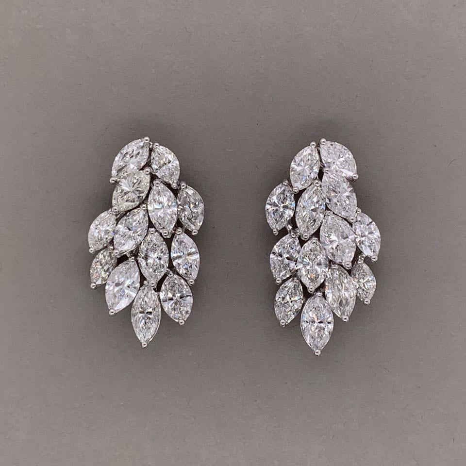 A lovely pair of diamond earrings made in 18k white gold. They feature 11.31 carats of fine marquise cut diamonds set as a waterfall cascading down your ear. Each stone is larger in size, weighing 0.43 carats each! Quality diamonds and quality make,