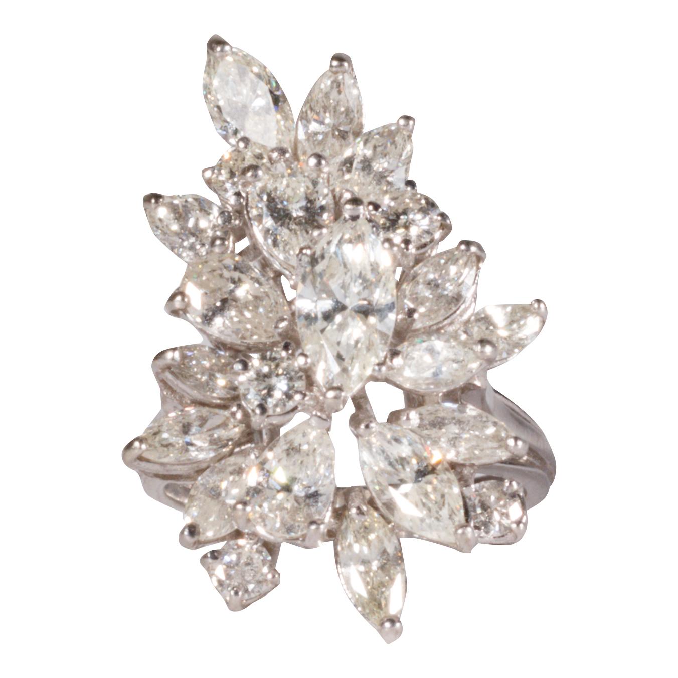 Beautiful large 18 Kt white gold diamond waterfall cluster ring, pear-shaped, round, with diamonds. 4.94ct marquise diamond tw.

PERIOD: Estimated 1940-50s

ORIGIN: U.S.

SIZE: Ring Sz: 7.5 Face: H1 1/4
