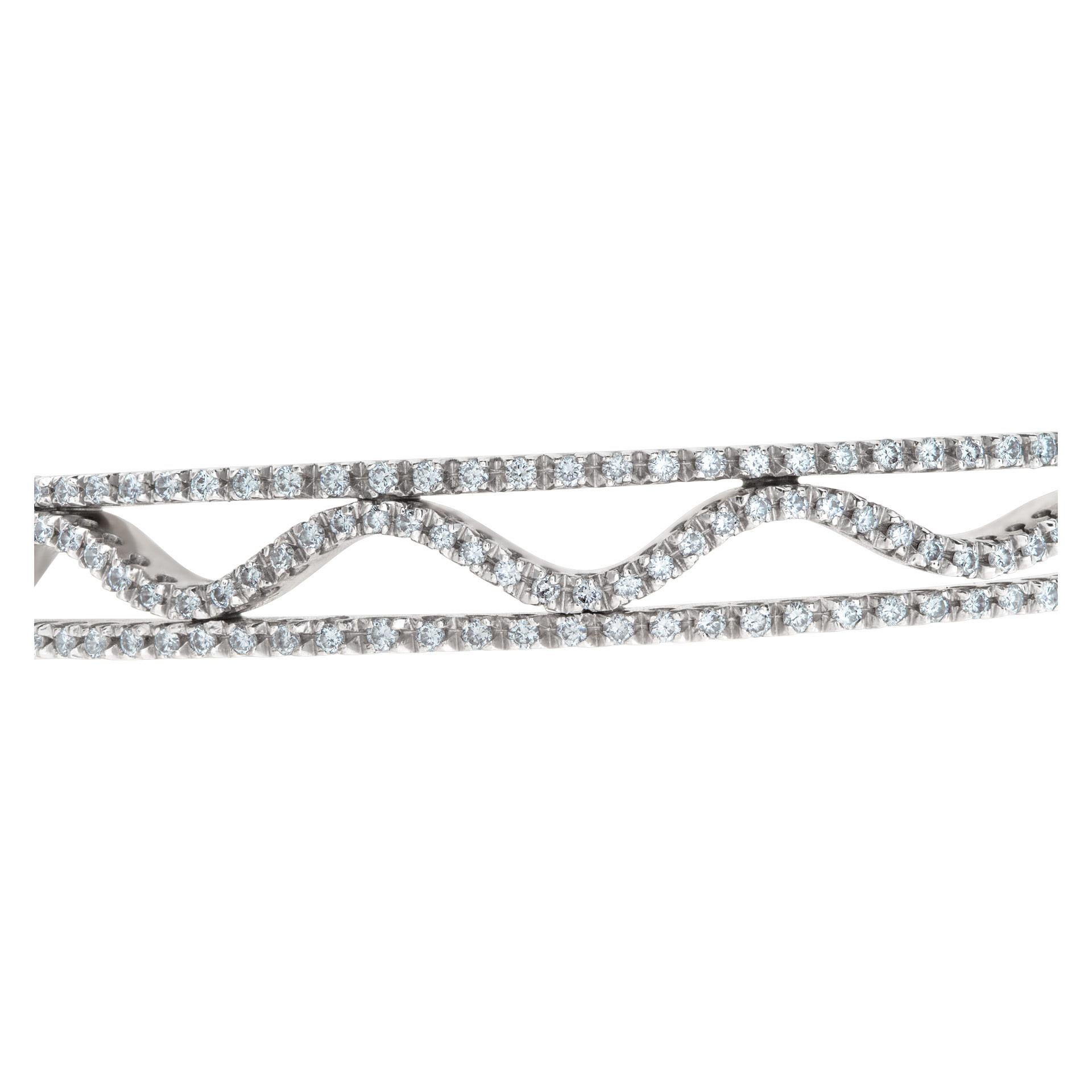 Gorgeous diamond wave bangle with approximately 2 carats in diamonds in 14k white gold. Fits 6