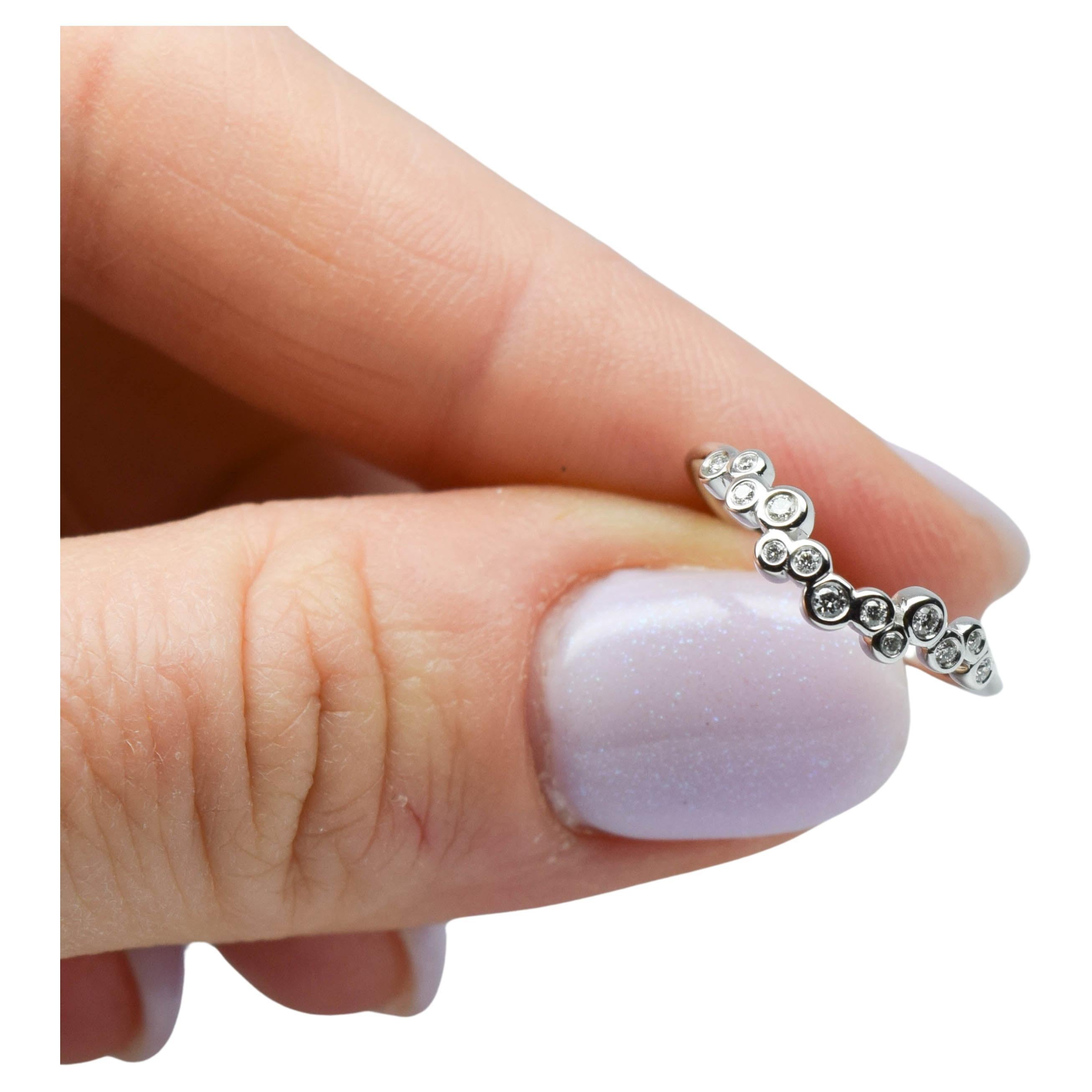 Diamond wedding band curved bezel diamond ring 14 Karat gold For Sale
