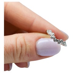Used Diamond wedding band curved bezel diamond ring 14 Karat gold