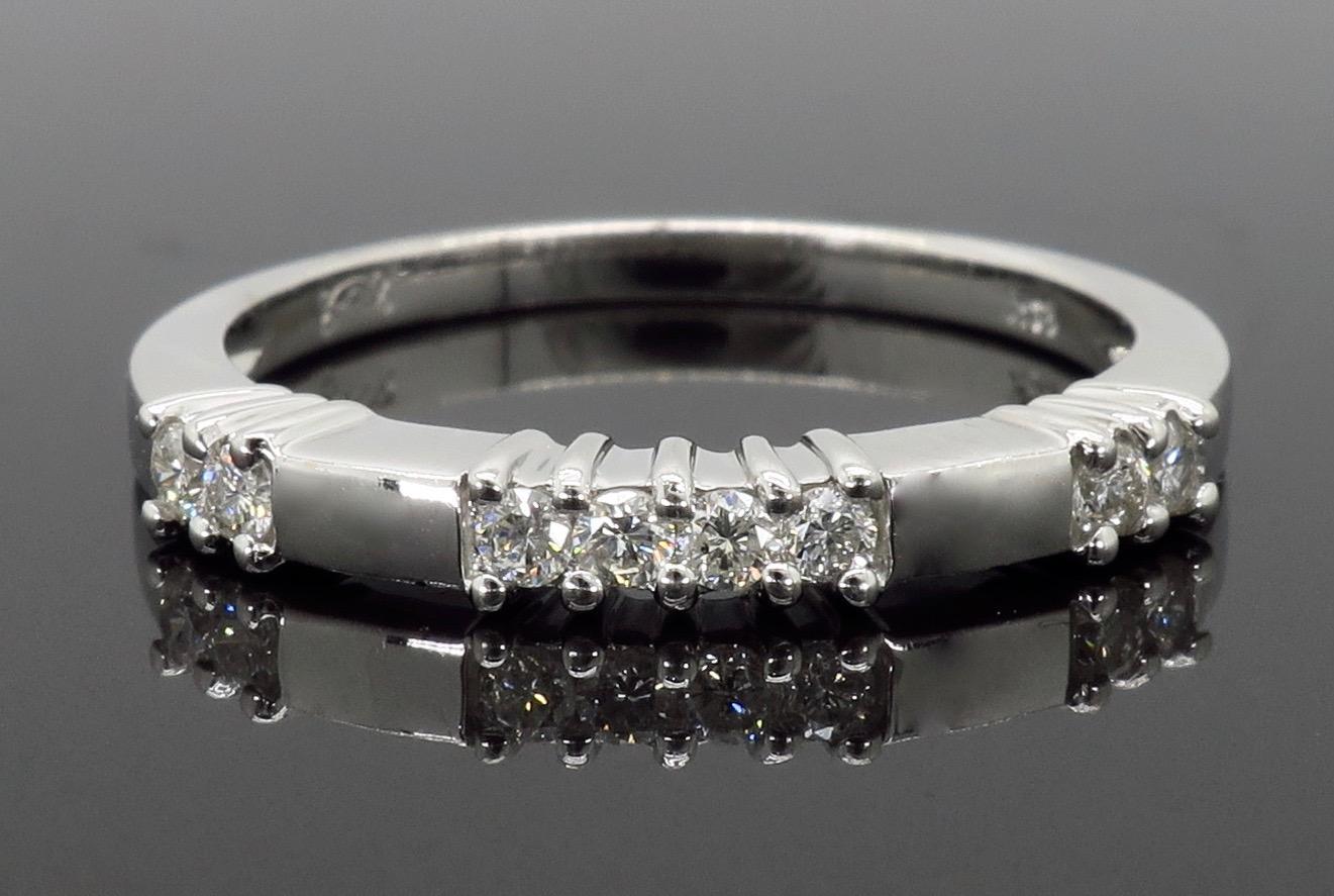 Unique diamond band crafted in 14K white gold.

Gemstone: Diamond
Diamond Carat Weight: Approximately .20ctw
Diamond Cut: Round Brilliant Cut
Color: Average G-H
Clarity: Average SI
Metal: 14K White Gold
Marked/Tested: Stamped “14K