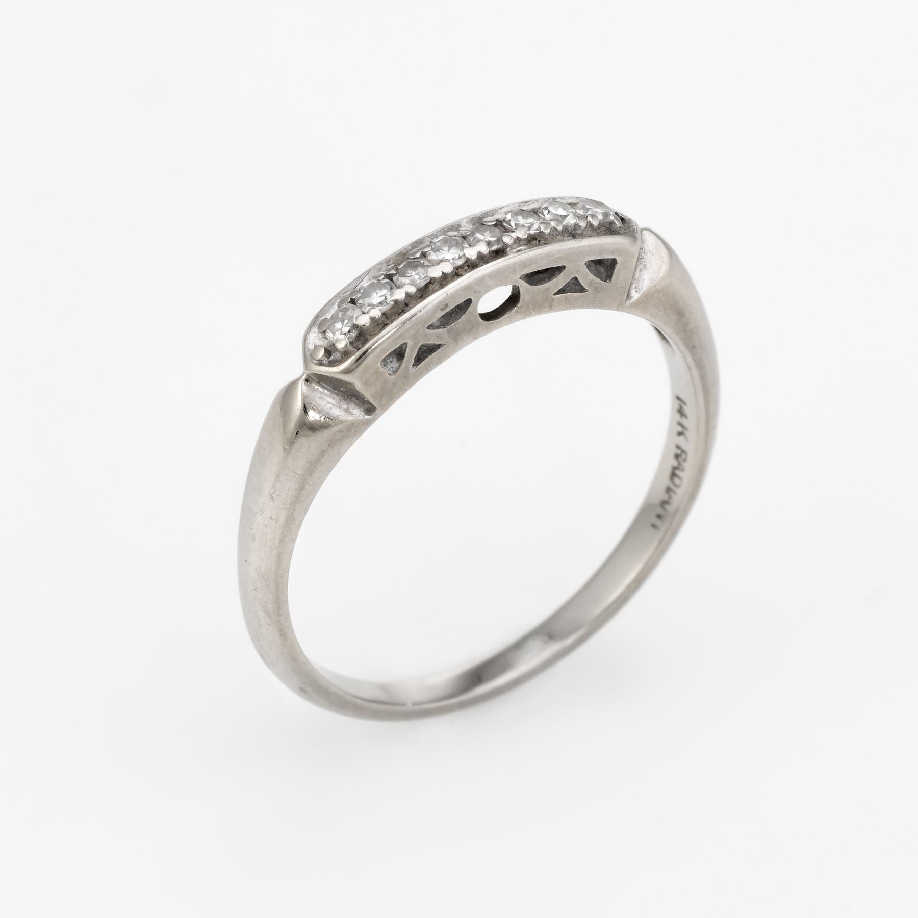 Finely detailed diamond wedding band (circa 1940s to 1950s), crafted in 14 karat white gold.

Single cut diamonds total an estimated .16 carats (estimated H-I color and VS2 clarity).
 
The ring is in excellent condition. 

Particulars:

Weight: 2.1