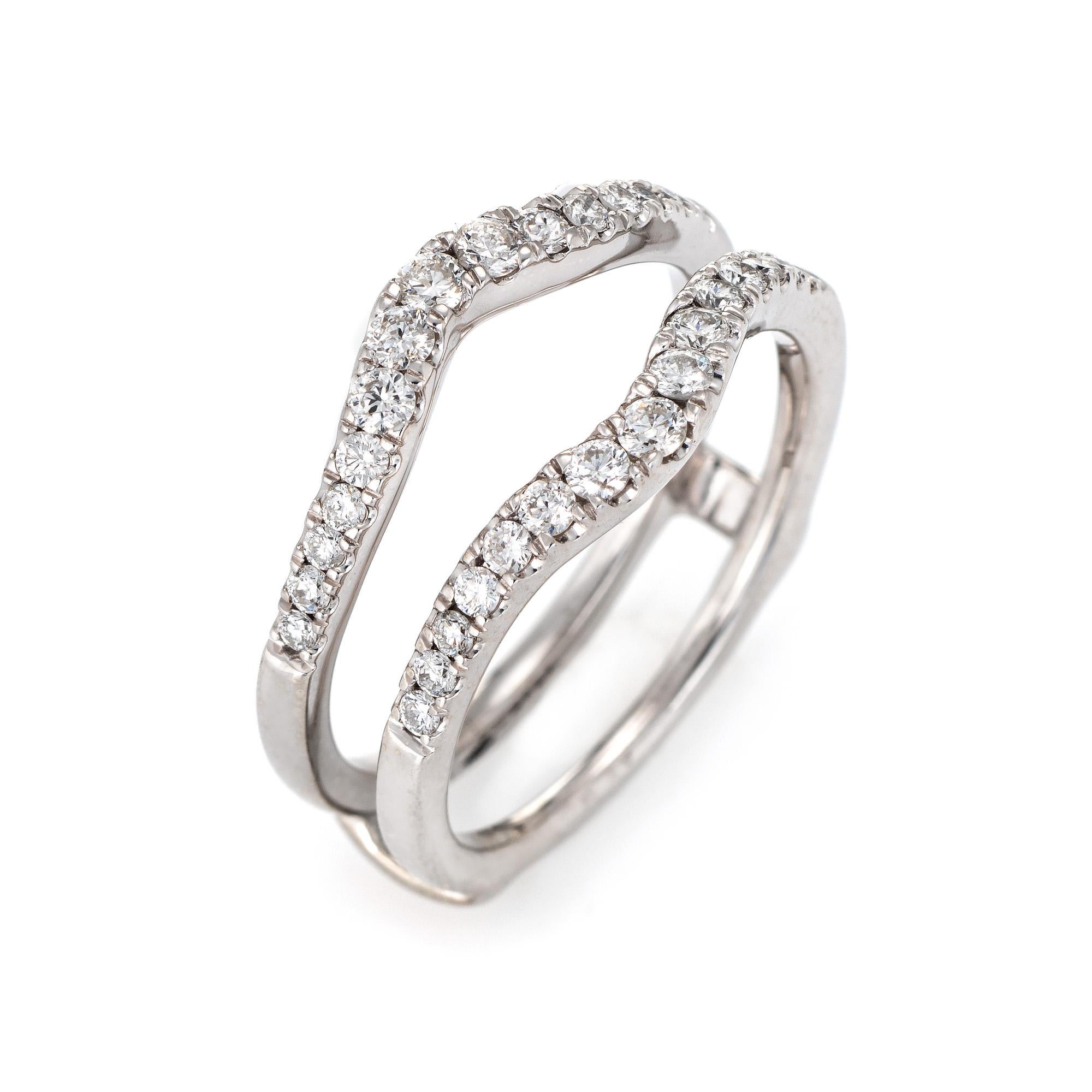 Stylish diamond wedding ring guard wrap crafted in 14 karat white gold. 

Round brilliant cut diamonds total an estimated 0.50 carats (estimated at H-I color and VS2-SI1 clarity). 

The ring guard opening measures 6mm wide an d can accommodate a